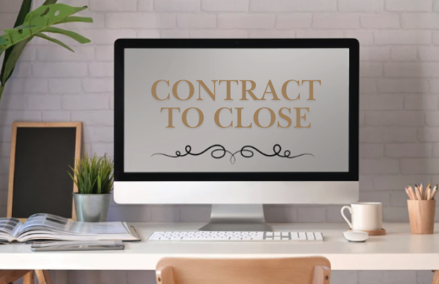 Computer monitor displaying the text "Contract to Close" on a white desk with office supplies, a plant, and a chalkboard in the background.