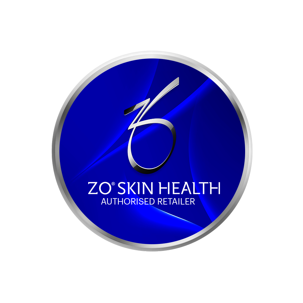 A mountain landscape with snow-capped peaks in the background and rolling green hills in the foreground, featuring a modern building with brown and stone exterior.