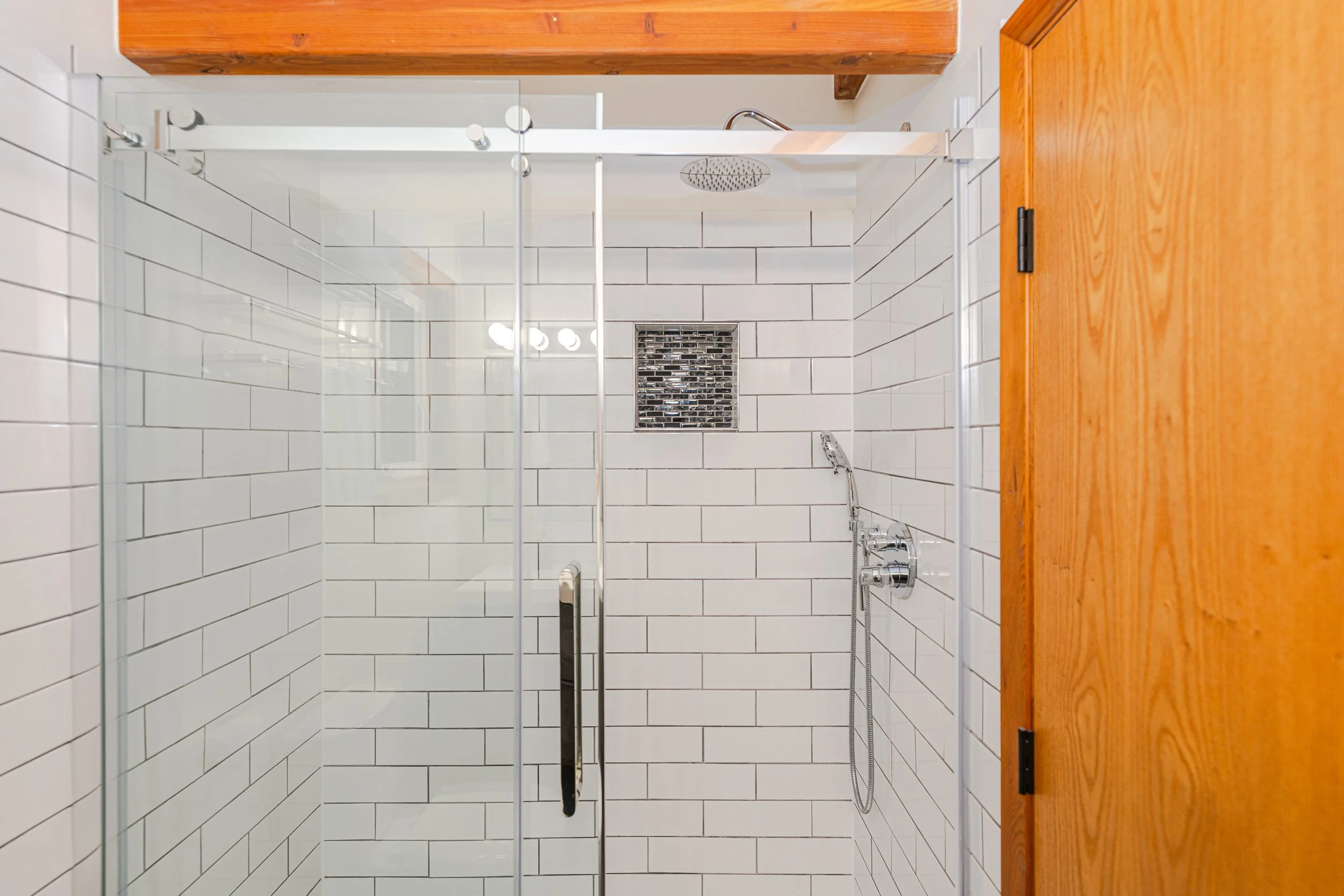 fully tiled and glassed in shower