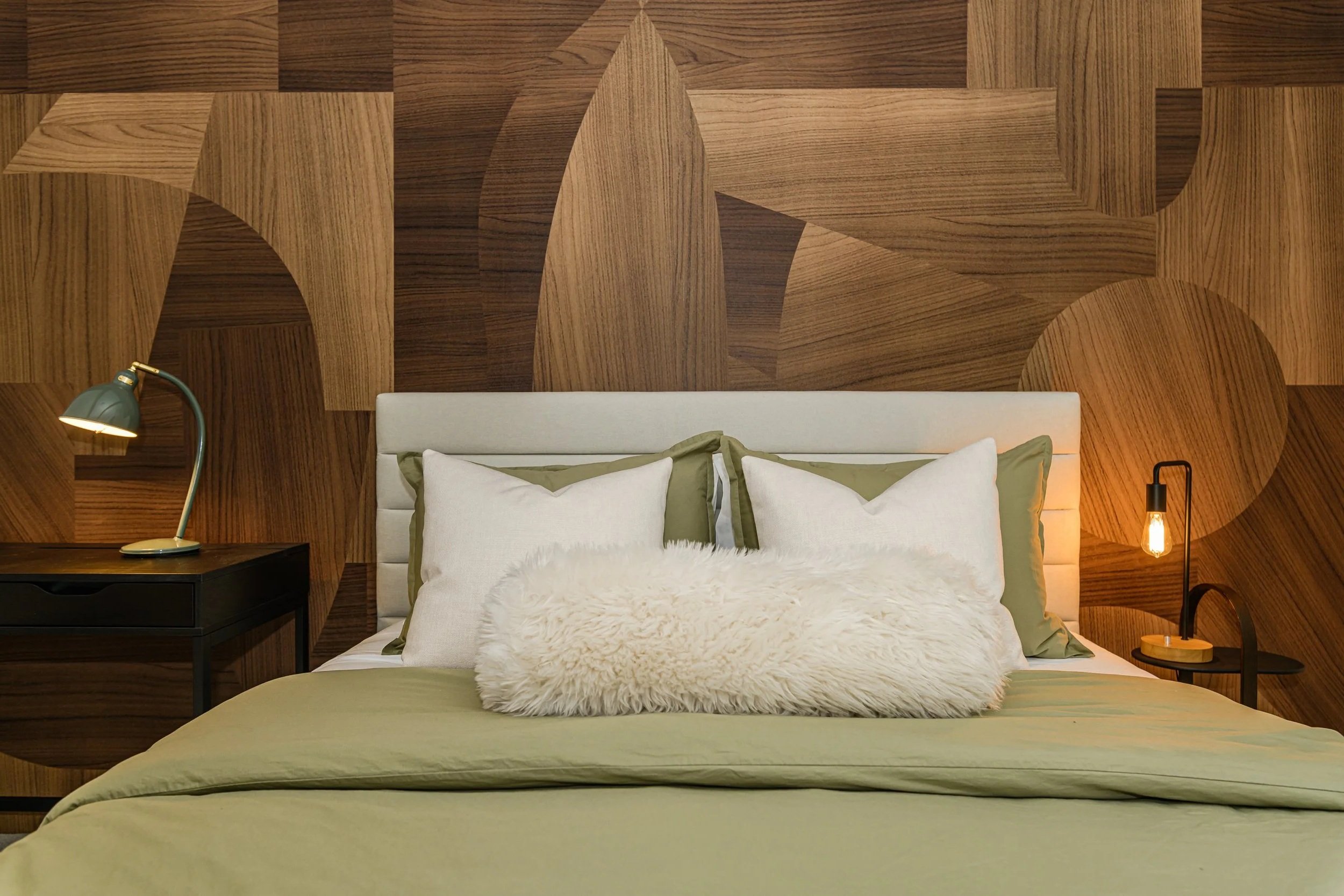 Close-up of a designer bedroom at MindWell House, showcasing the high-end mattress, comfortable linens, and a clean, restful aesthetic.