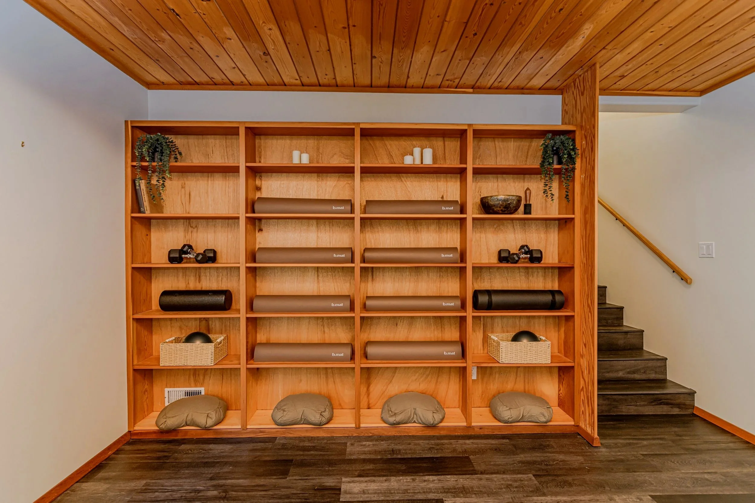 shelve of yoga pillows and bmats