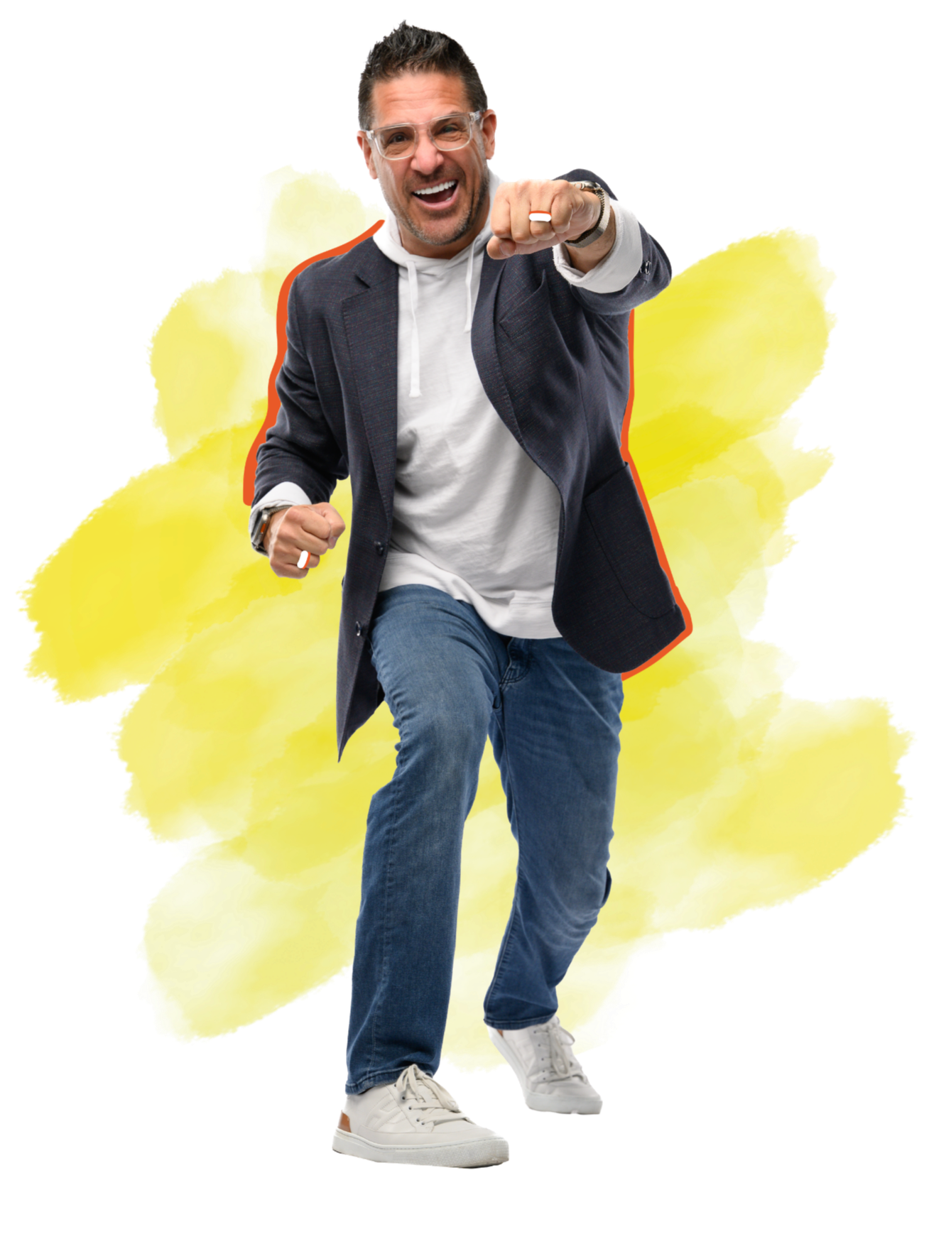 A man in a suit jacket, white hoodie, jeans, and sneakers is smiling and running towards the camera with his fist clenched. He is wearing glasses and a watch, with a lively yellow watercolor background behind him.