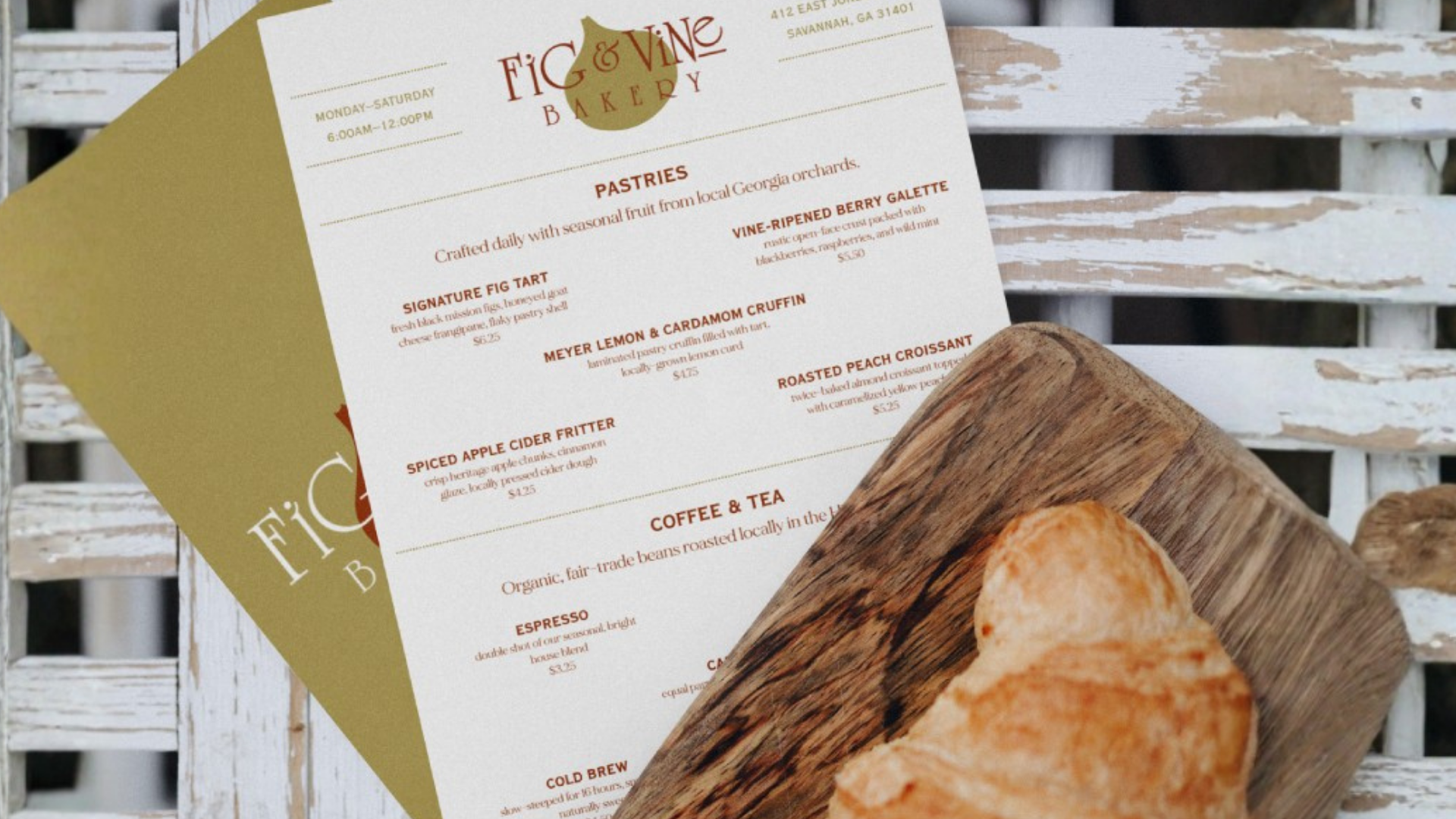 Fig & Vine's menu next to a croissant.