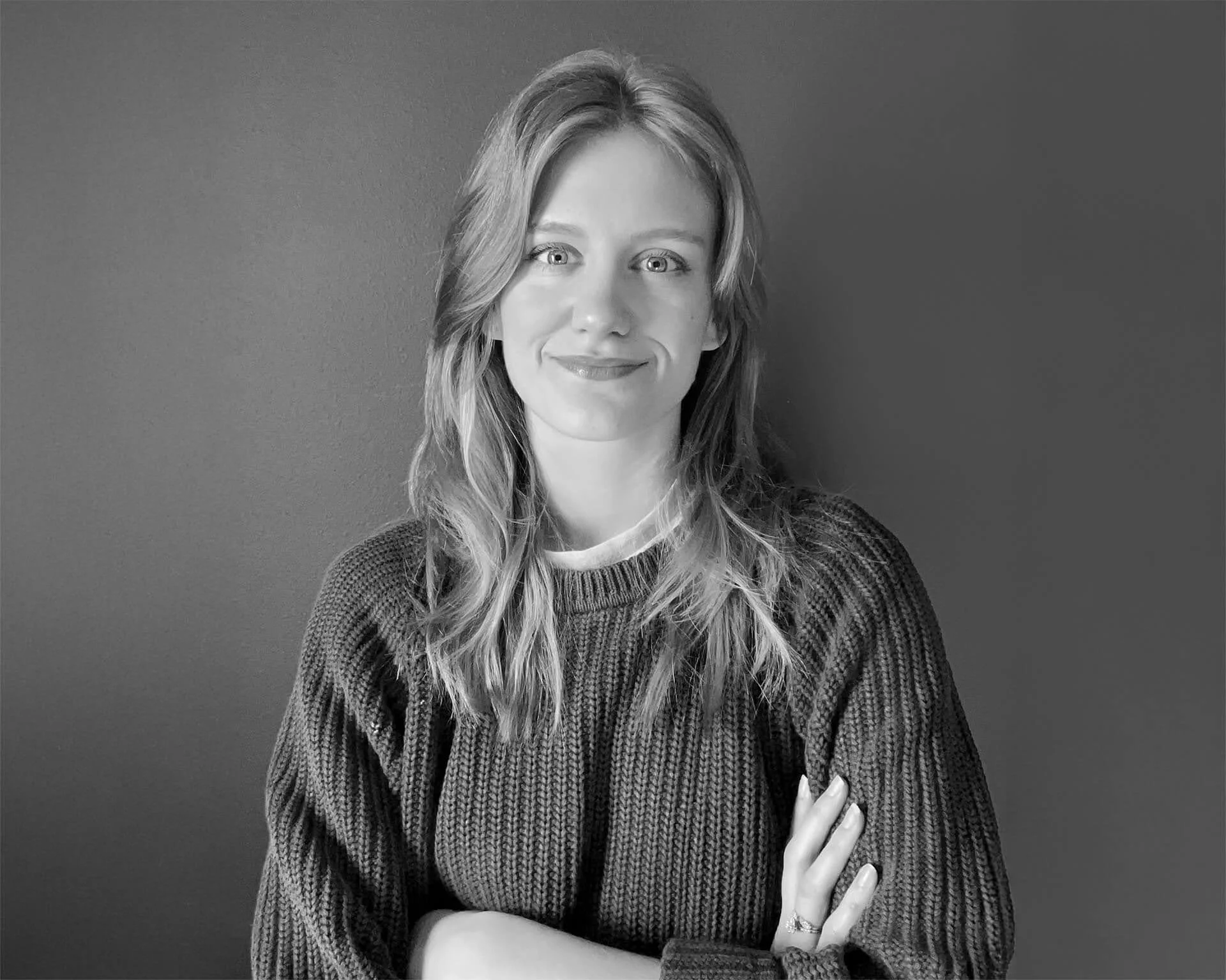 Black and white headshot of a woman.