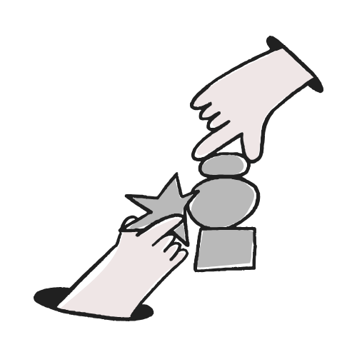 two hands putting shapes together