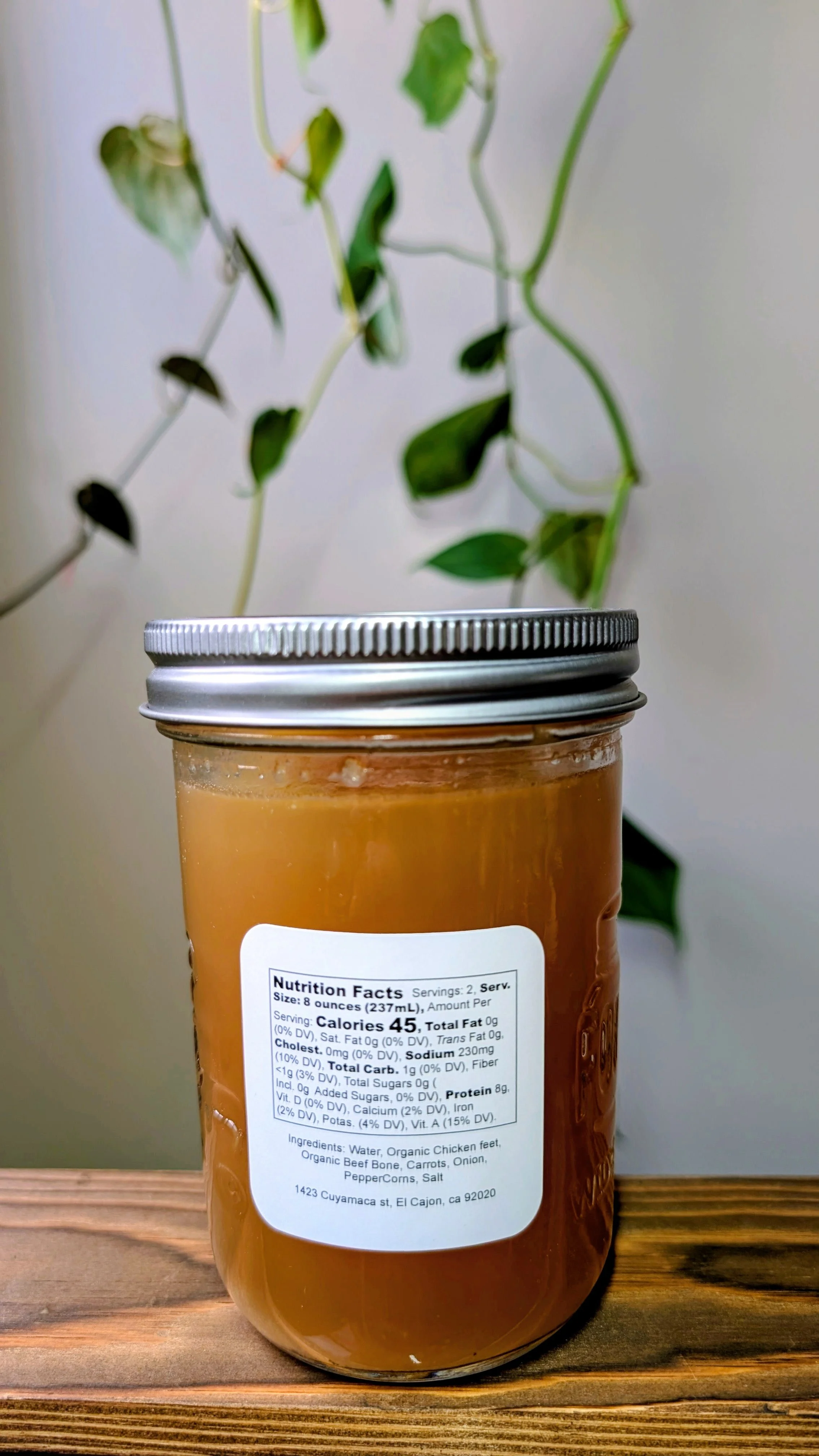 Golden Coast bone broth sitting on a kitchen counter with nutritional label