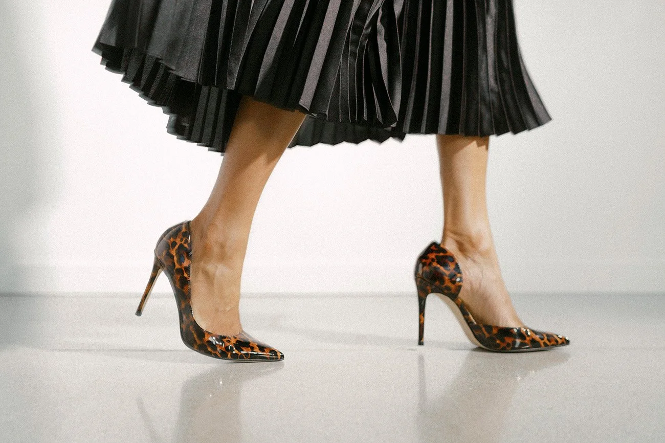 Shayla C. Higginbotham walking in professional setting at System Partners.