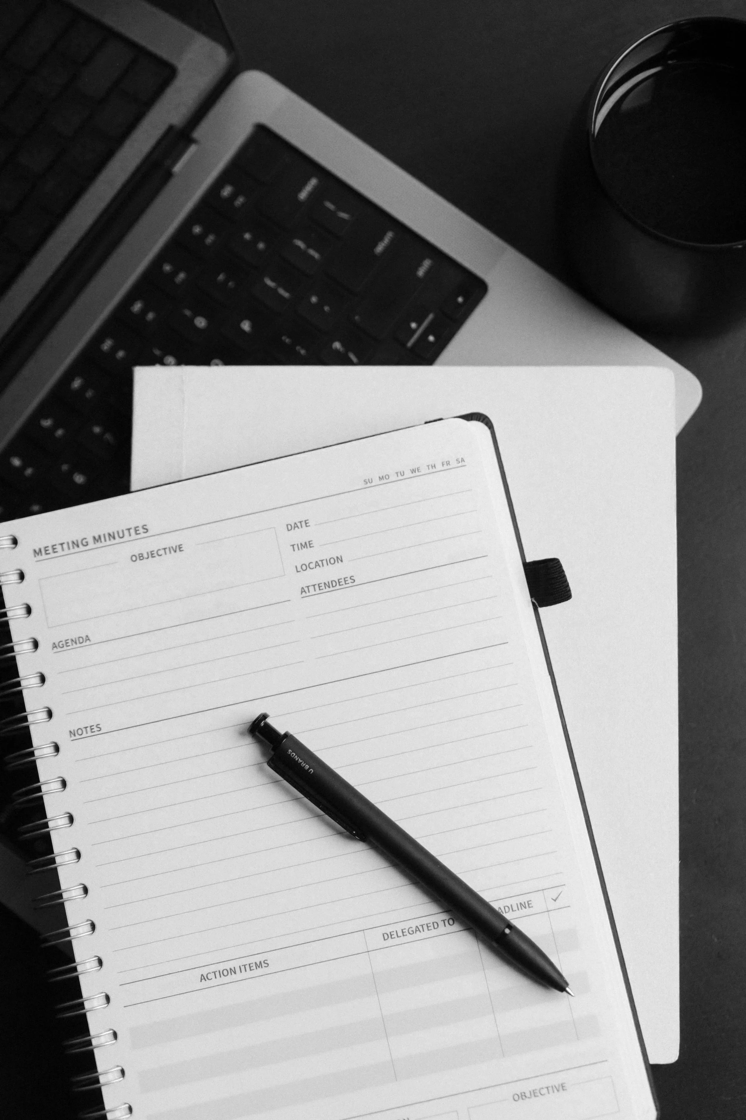 Healthcare strategic planning work session with notebook and materials.