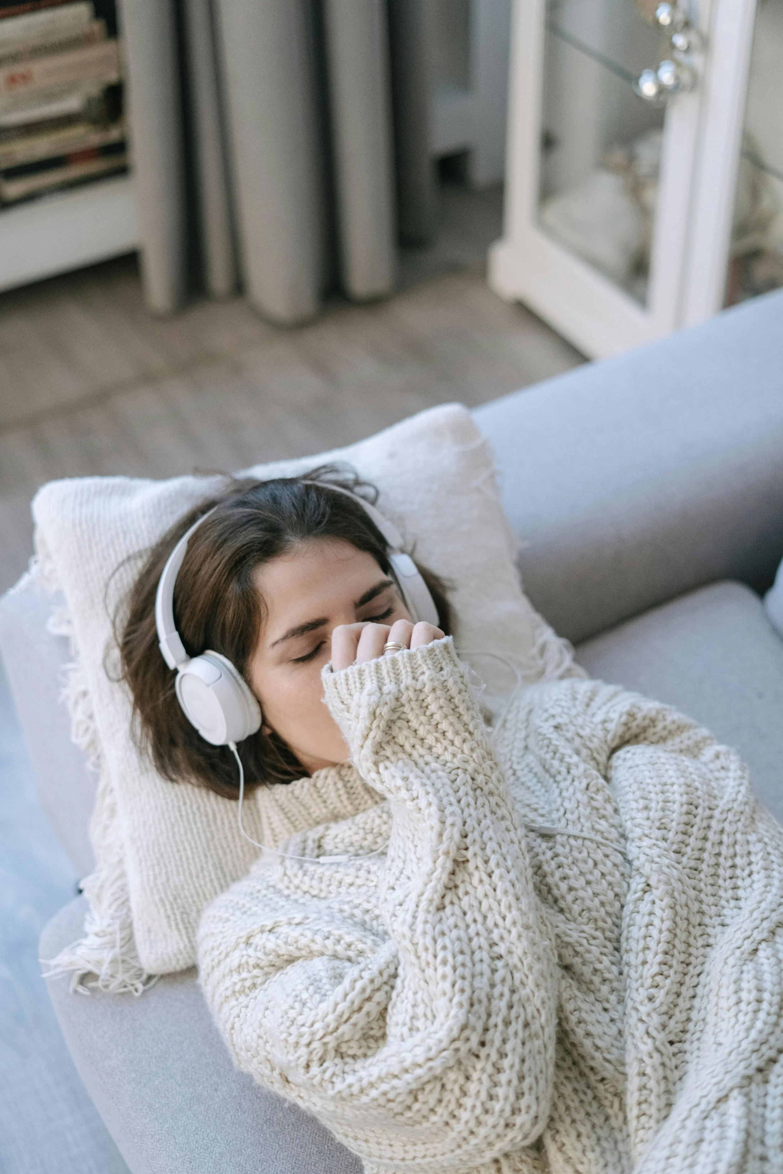 Woman lying awake in bed looking at the ceiling, representing a wired nervous system, sleep difficulty, and the Rest and Restore Protocol for nervous system regulation in Carmel-by-the-Sea.