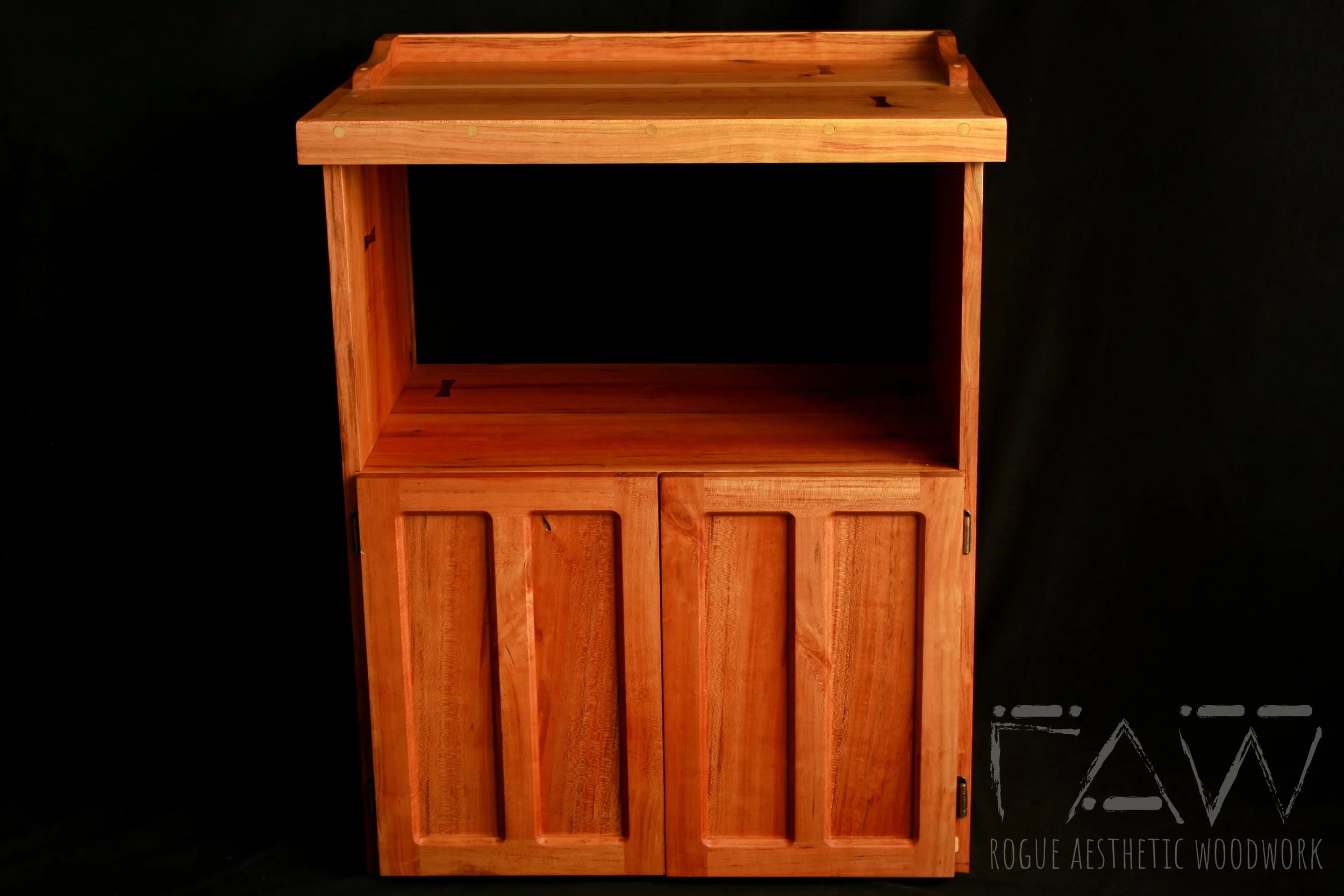 solid cherry hardwood coffee stand with shaker style cabinet doors and a low hand shaped curved rail — bespoke furniture by Rogue Aesthetic Woodwork, High Springs FL