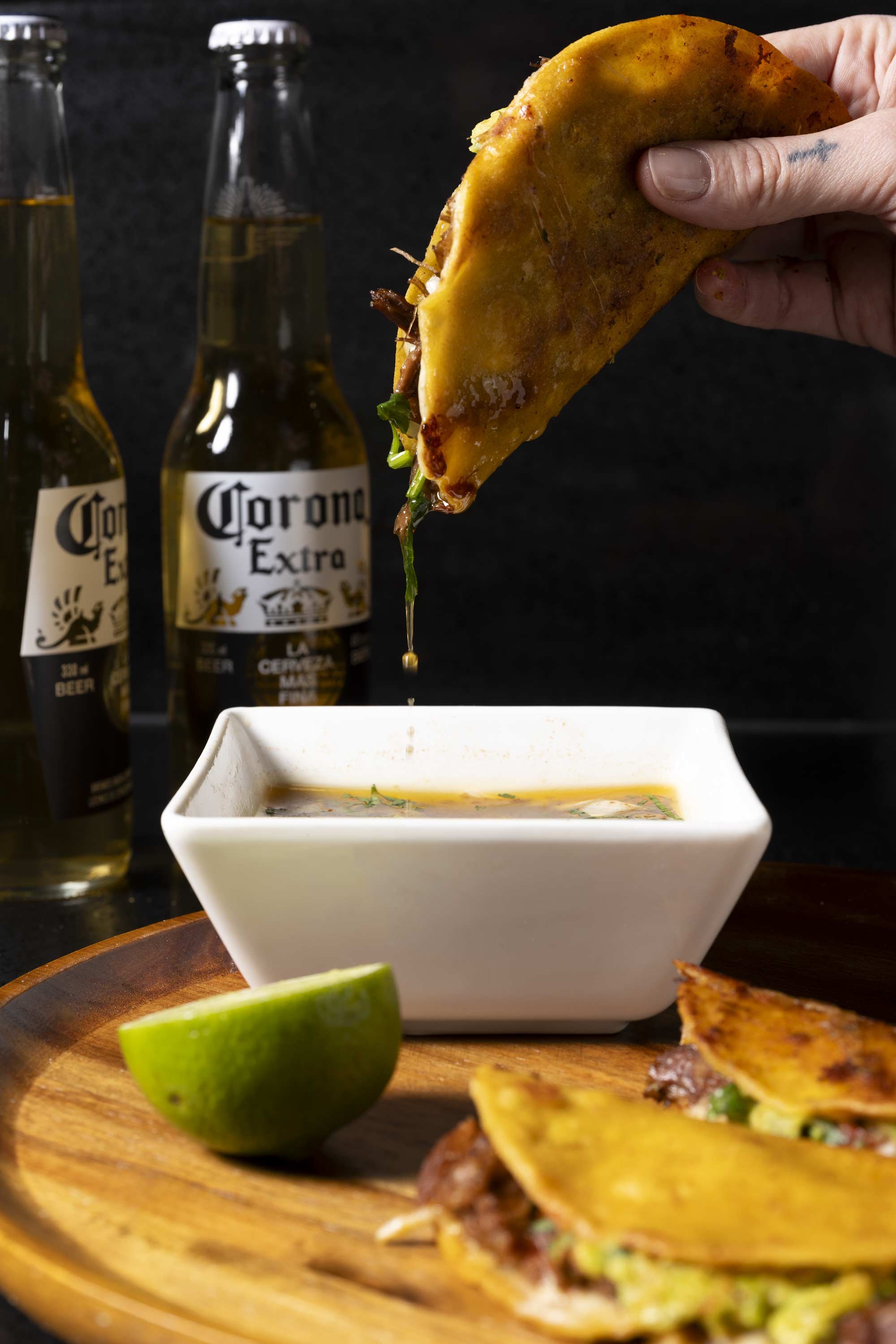 birria taco served with beer