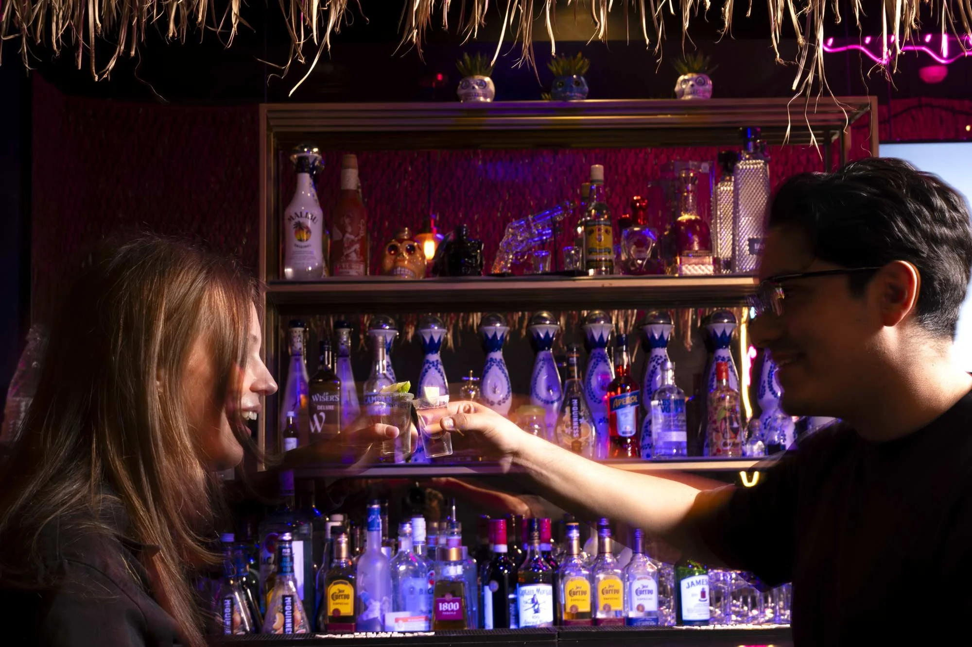 people celebrating at a tequila bar