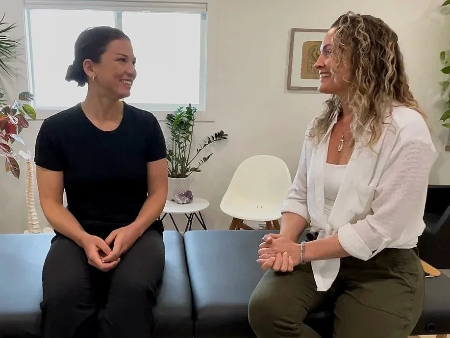 Tara guiding a client through a gentle, in-person healing session at InnerBloom Healing in Kelowna BC