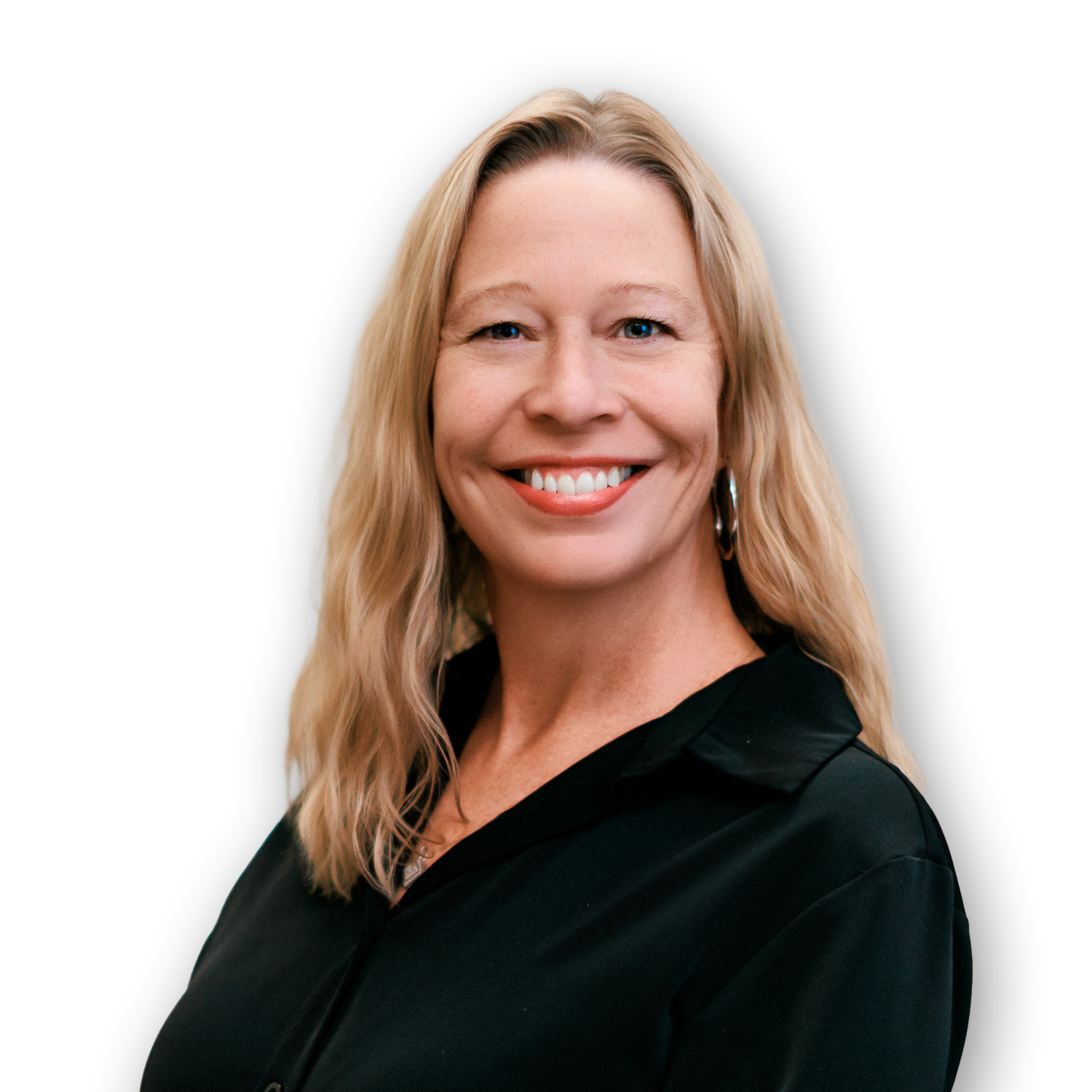 A woman with long blonde hair smiling against a black background