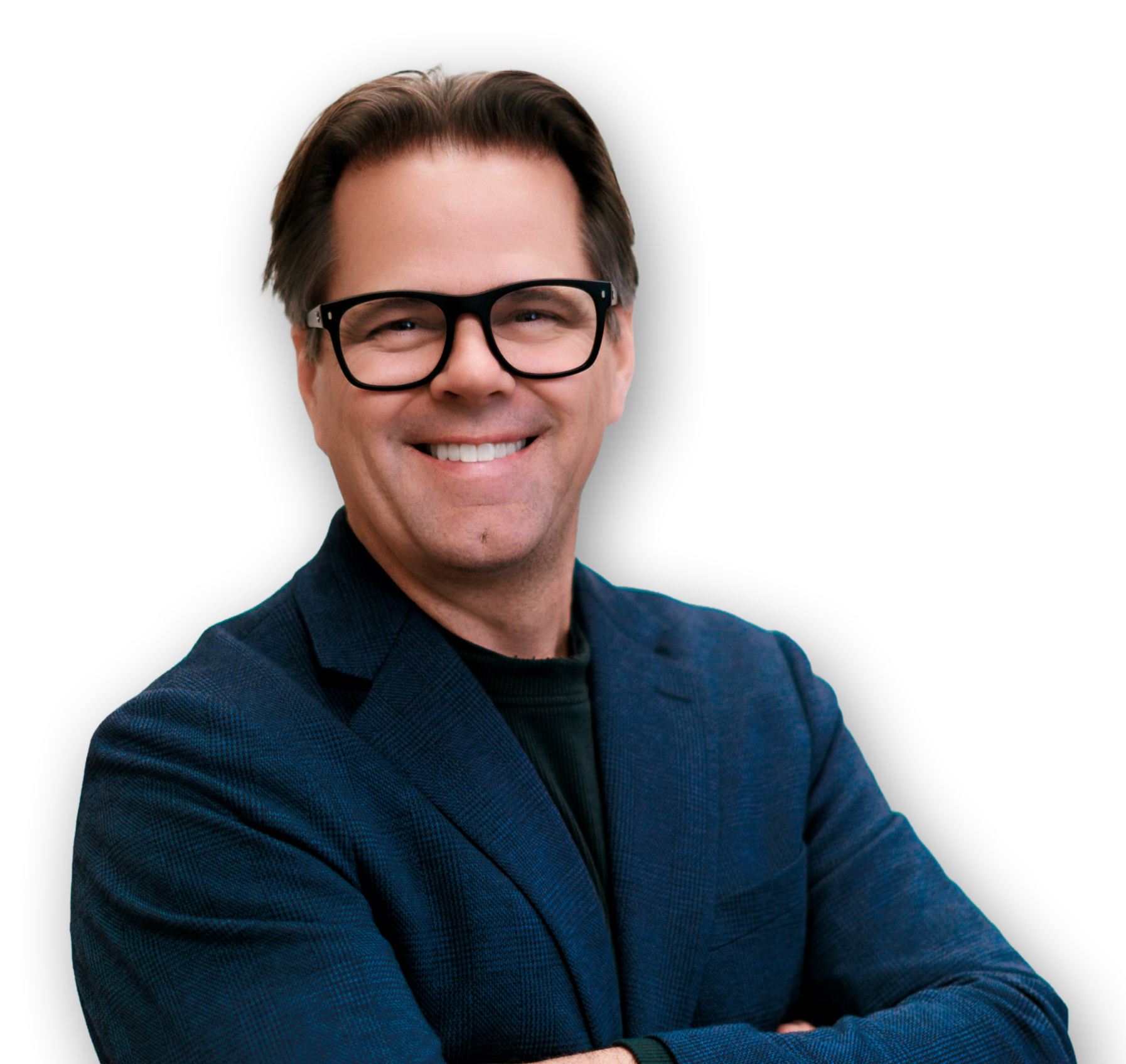 Smiling man with glasses wearing a dark blue blazer against a black background.