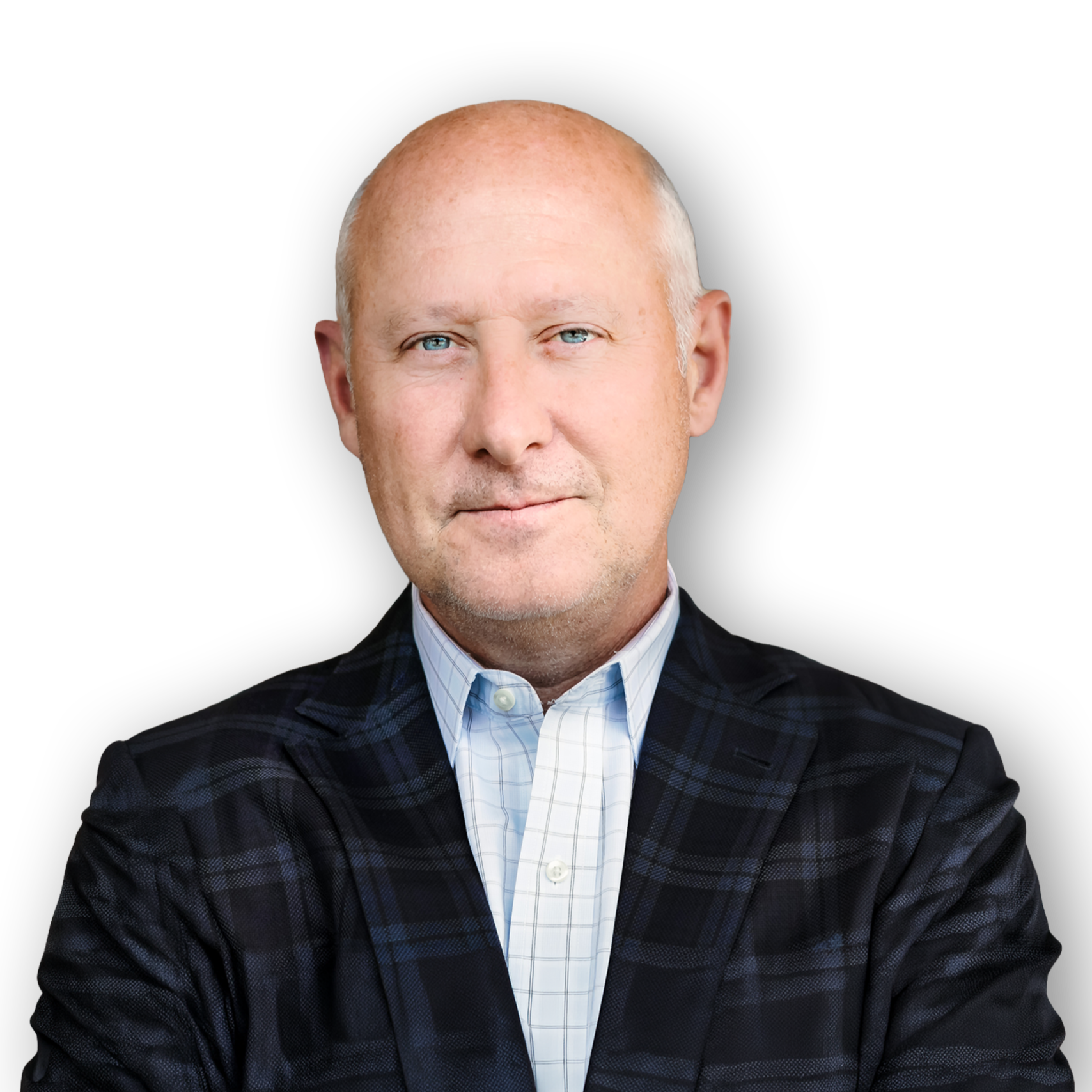 Portrait of a bald man wearing a dark plaid suit jacket and a light blue checkered dress shirt, with arms crossed against a black background.