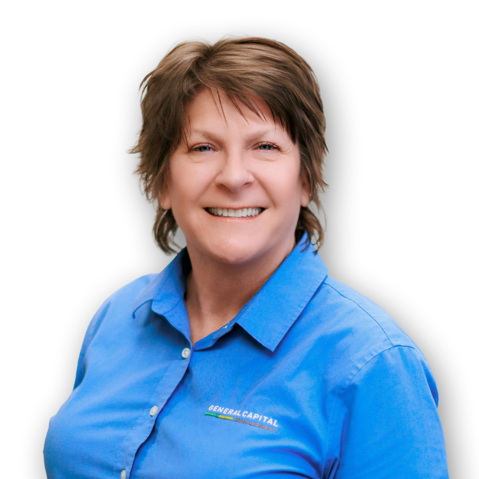 A woman wearing a blue shirt with a company logo, smiling against a black background.