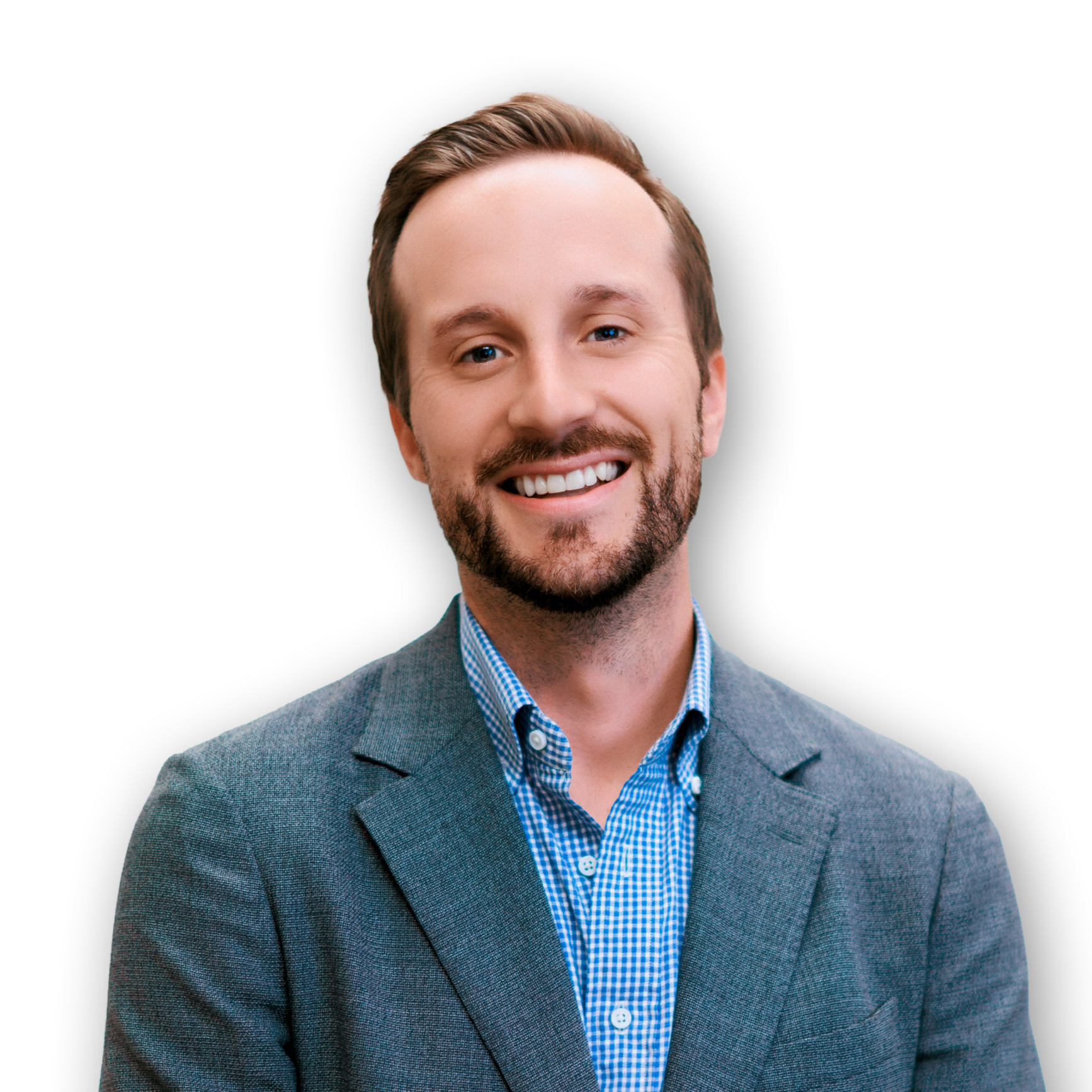 Professional headshot of a smiling man in a gray blazer and blue checkered shirt against a black background.