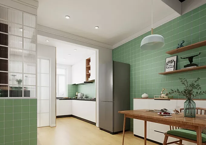 Modern kitchen with white cabinets, green tiled wall, and wooden accents.
