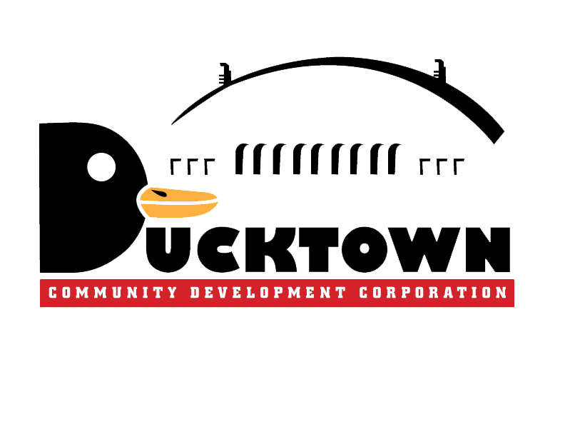 Logo for Ducktown Community Development Corporation featuring a cartoon duck head with a beak, the word 'Ducktown' in bold, and a red banner below with white text reading 'Community Development Corporation'.