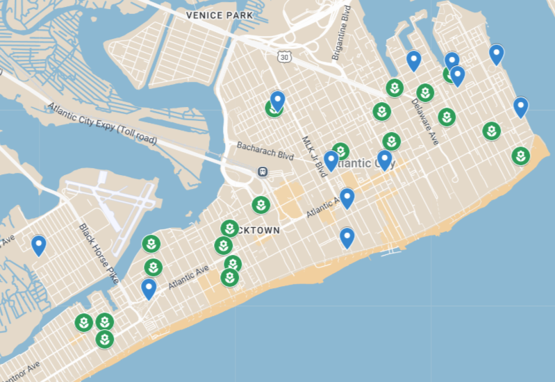 Map of Atlantic City showing numerous blue location markers and green park icons along the coastline and inland streets.