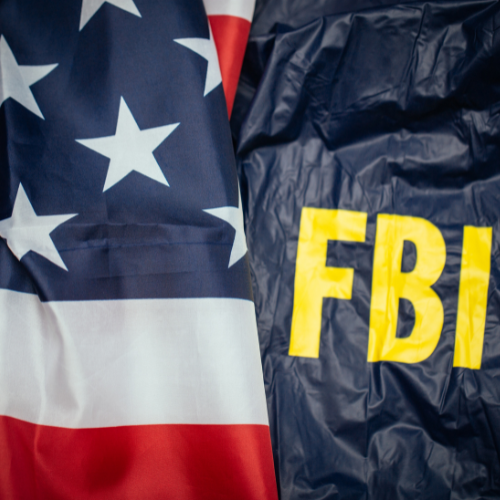 Close-up of the American flag and an FBI jacket.