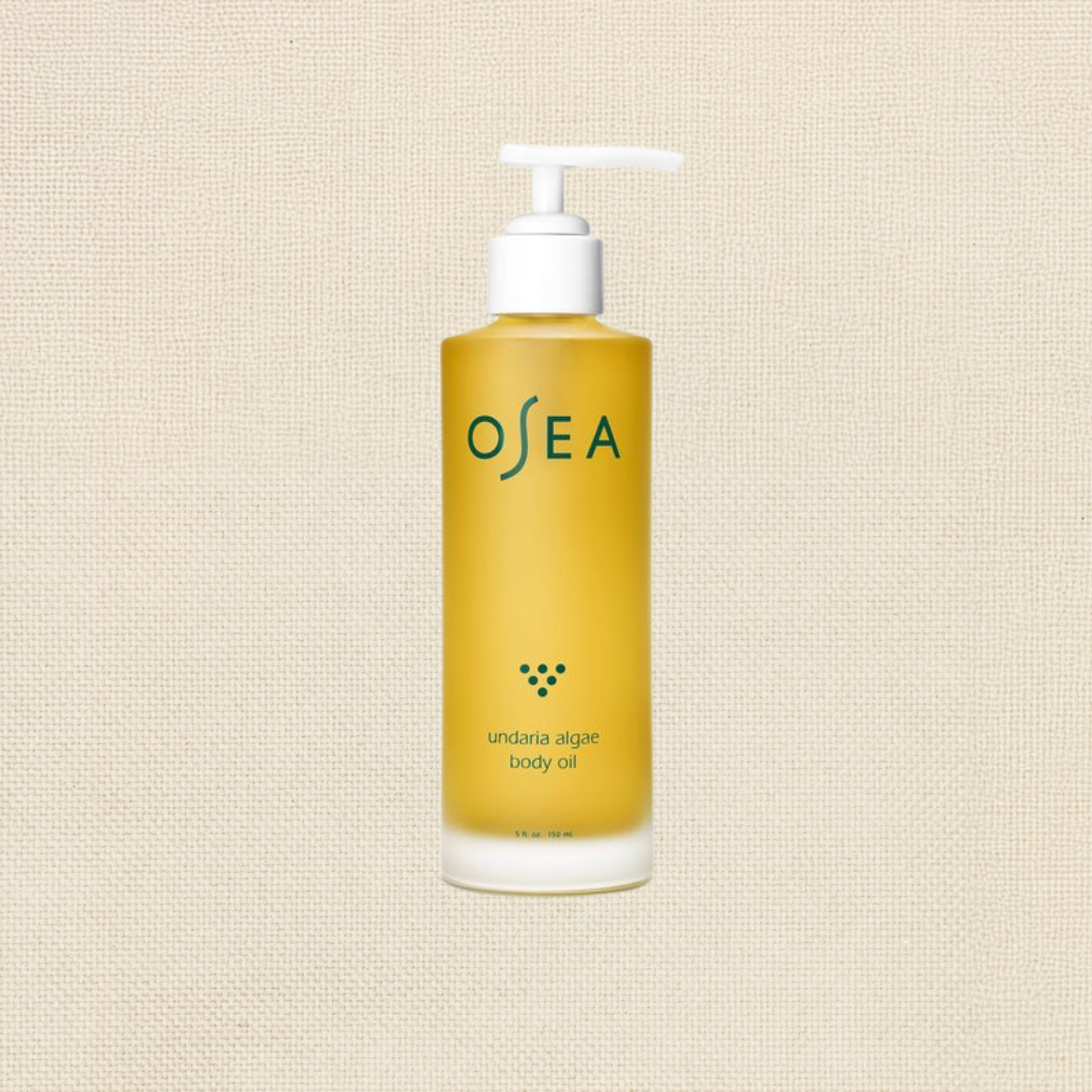 Yellow bottle of Ocean Undaria Algae Body Oil with a white pump dispenser on a beige textured background.