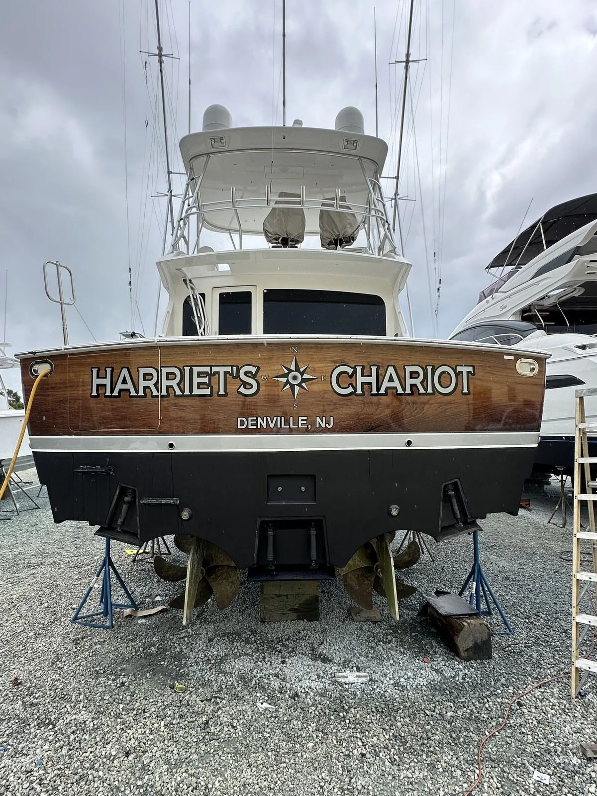 Sportfish transom wrap installation — Tidal Wave Customs Palm Beach County
