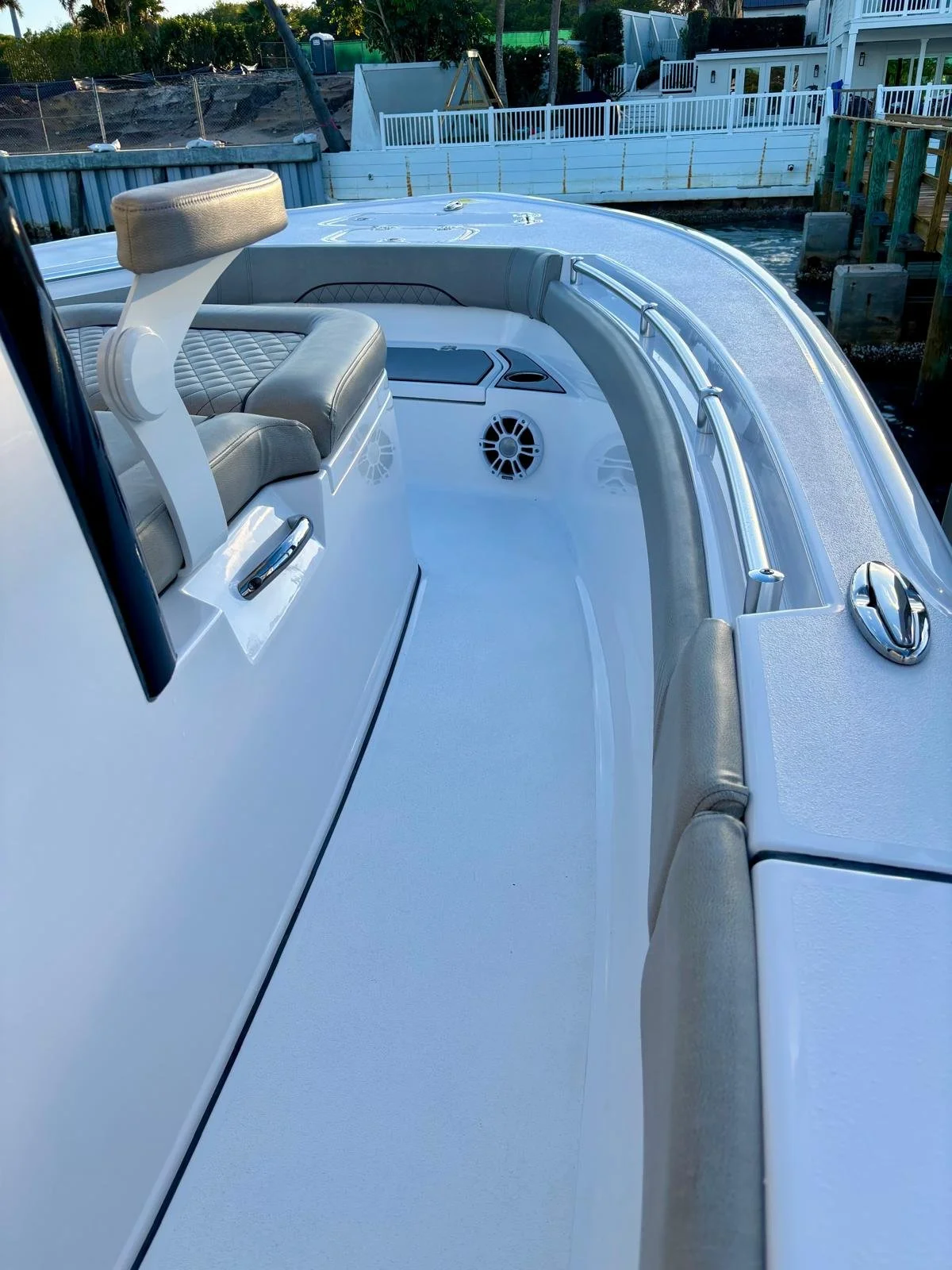 Detailed boat cockpit interior with clean upholstery and stainless