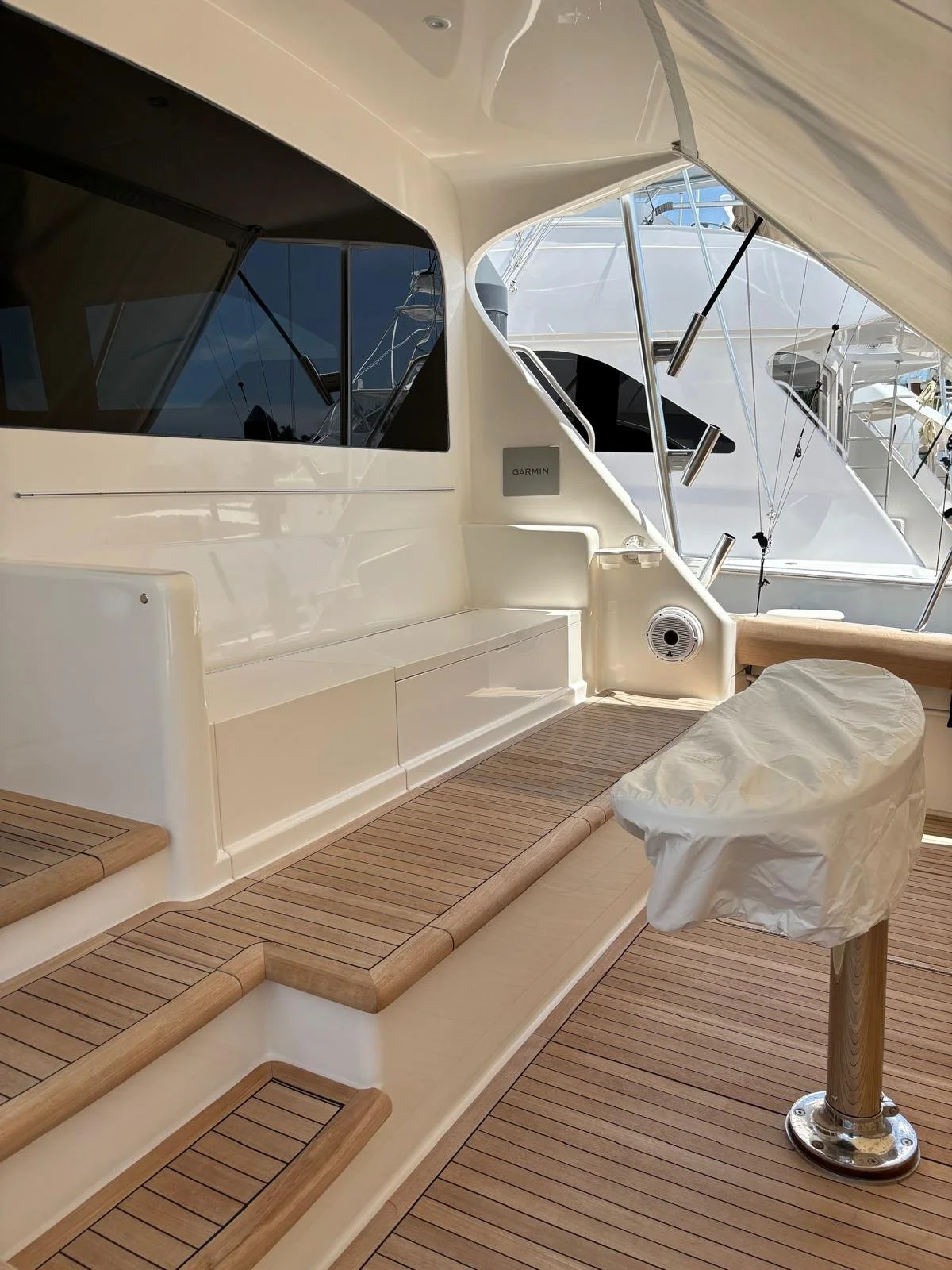 Freshly detailed black-hull sportfisher at the dock