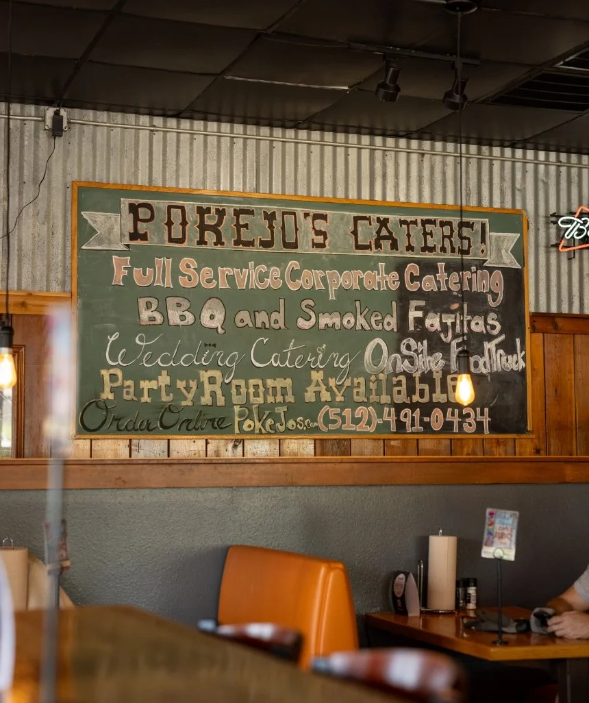 Pok-E-Jo’s catering sign promoting barbecue catering services.