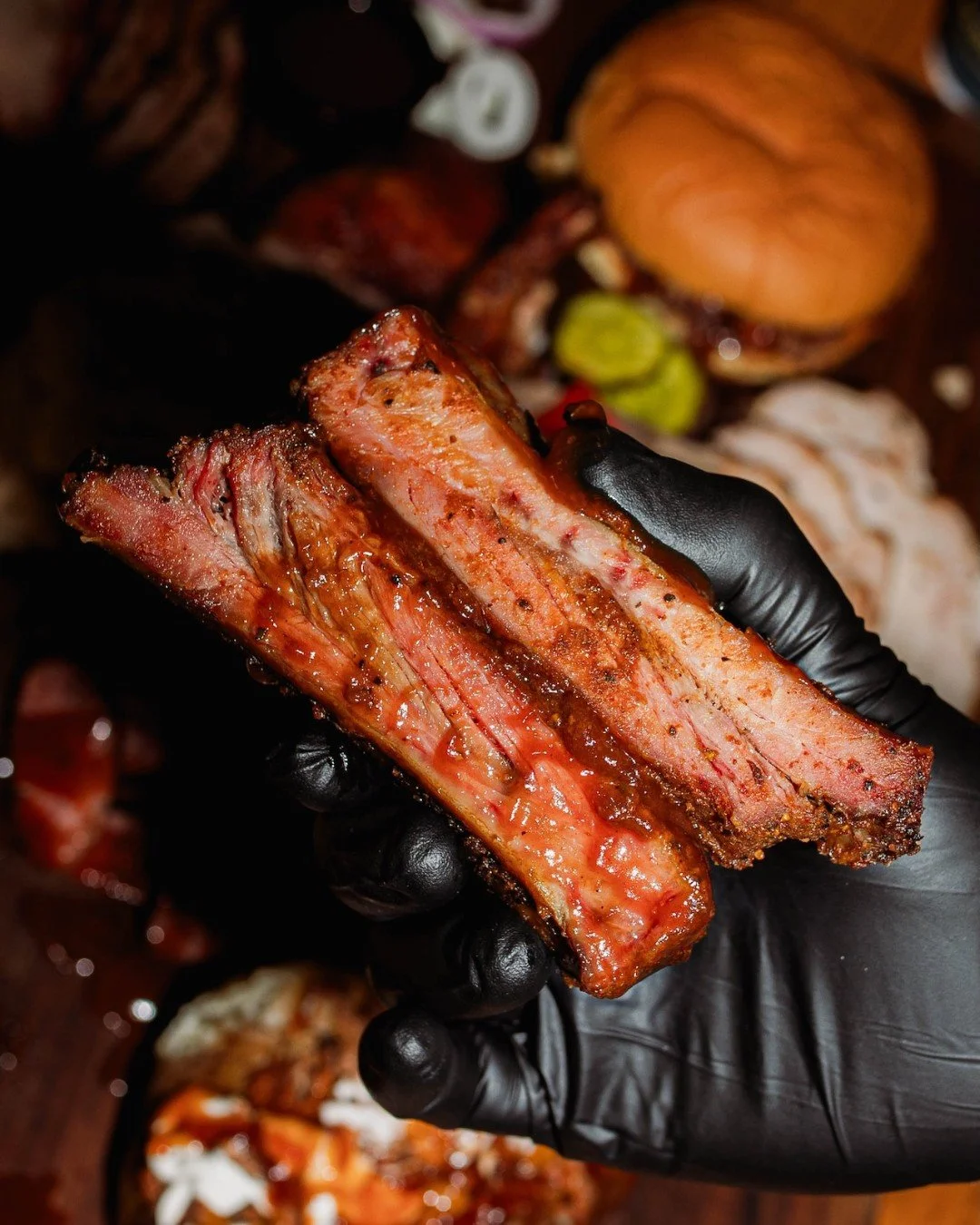 Messy hands, big smiles, and ribs worth every bite. 🔥 Come get something that makes table manners optional.
