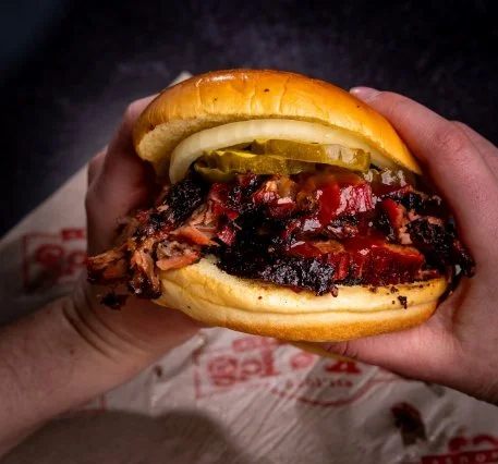 Brisket sandwich with sliced smoked beef.