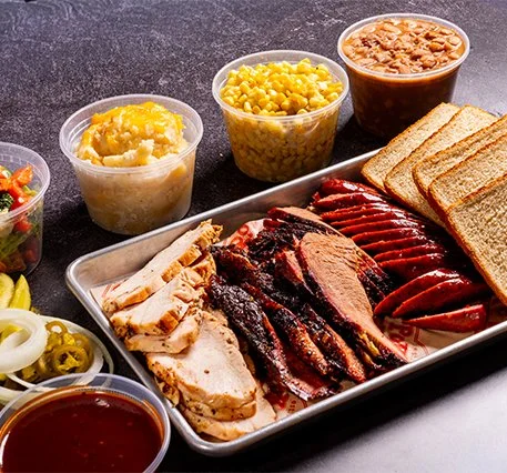 Family BBQ pack with assorted meats and sides.