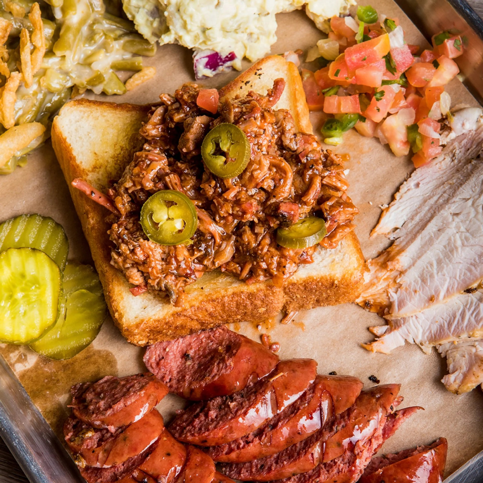 Assorted Texas BBQ meats with toast.