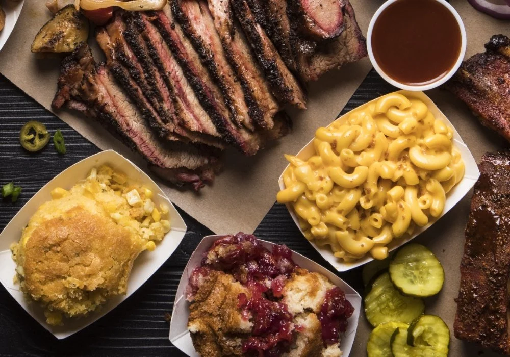 BBQ platter with smoked meats and classic sides.