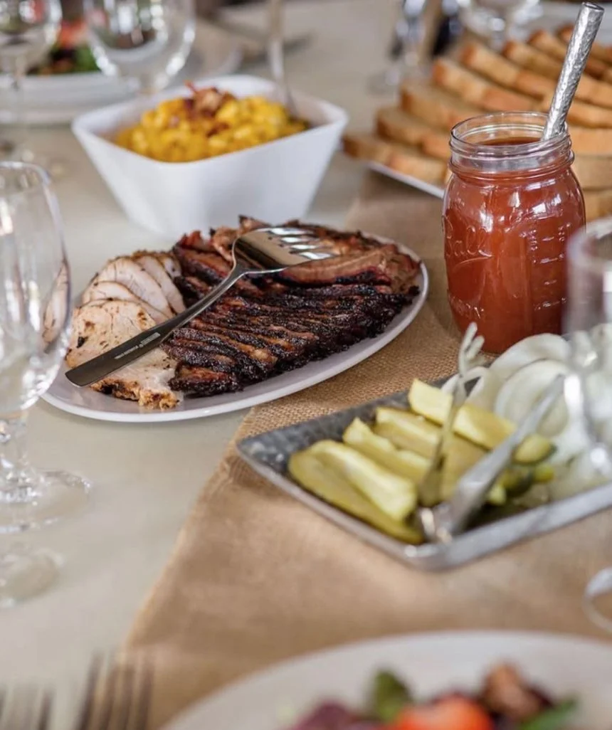 Catered Pok-E-Jo’s barbecue spread set up in a party room.