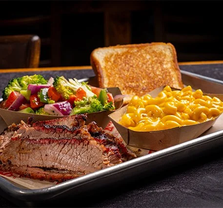 Brisket plate with smoked brisket and sides.