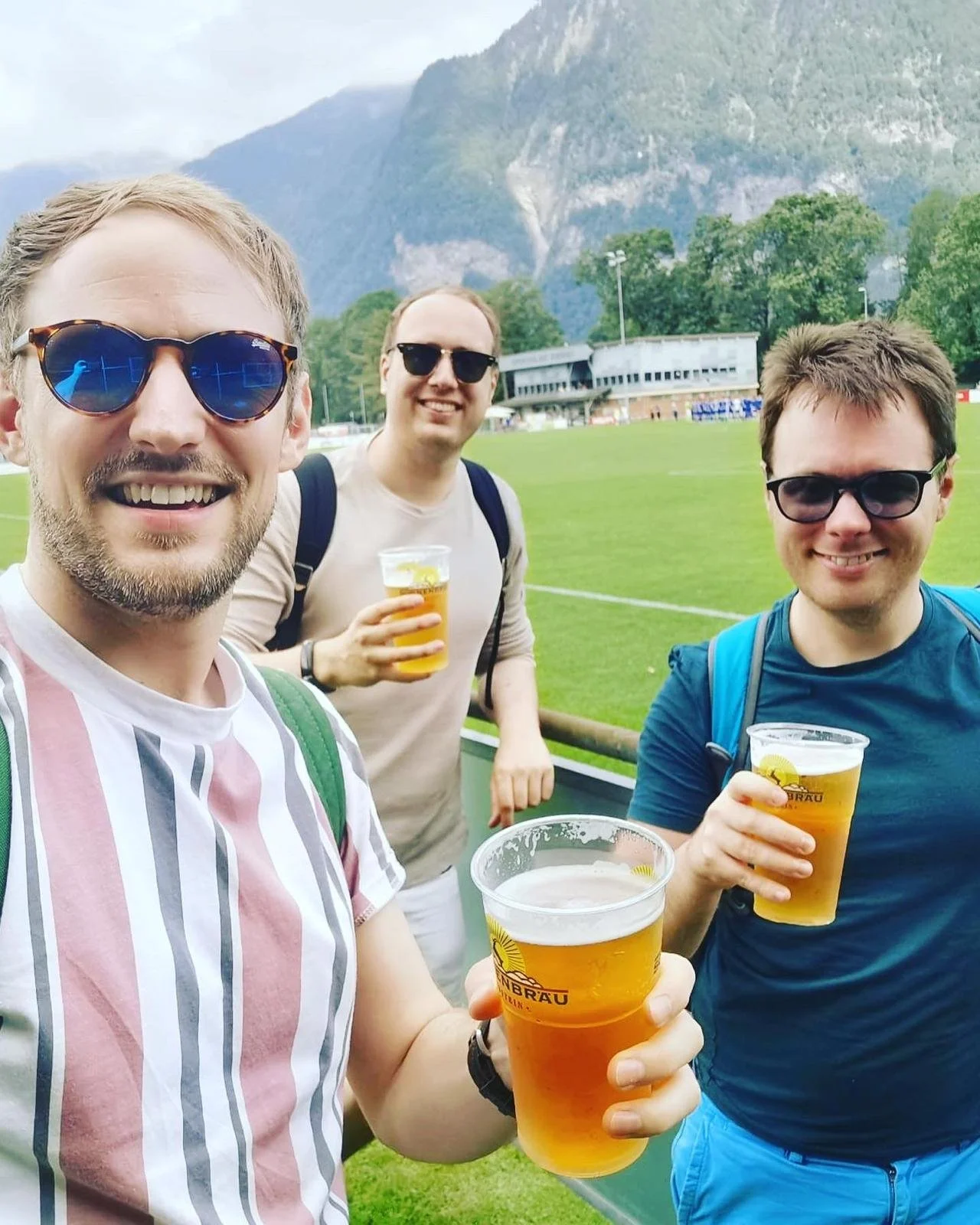 Enjoying a pre-match beer with a mountain view at Sportplatz Rheinau.