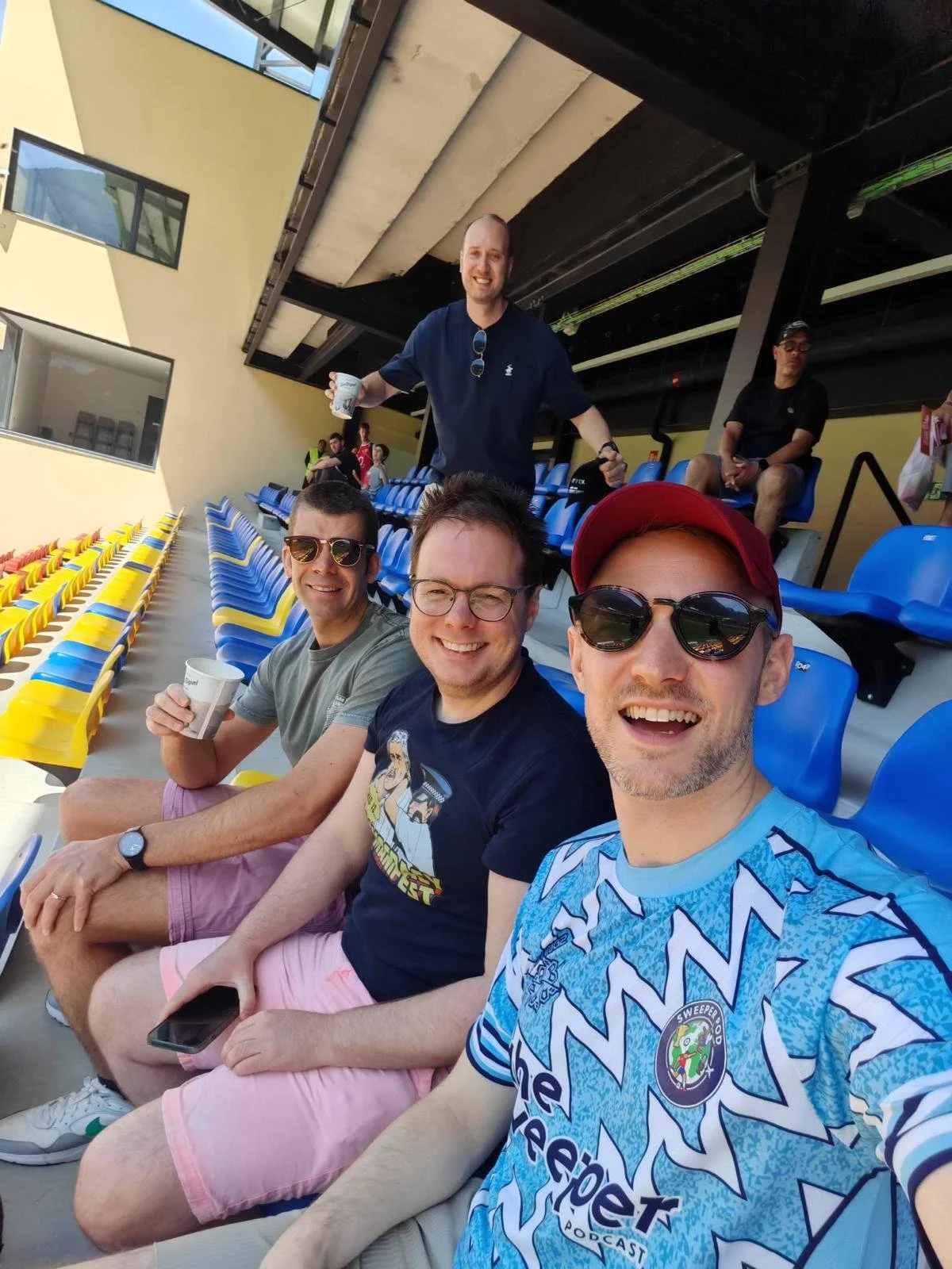 Host Lee, Producer Tom and friends Joss and Simon enjoying a drink in the stands prior to kick off in the match.
