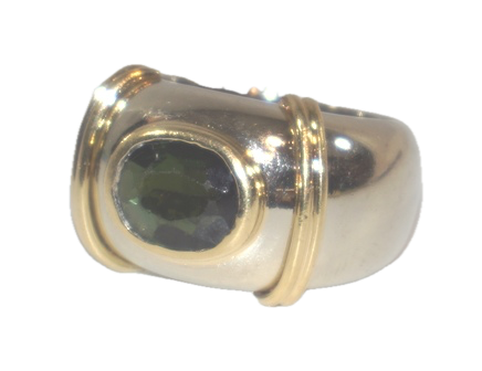 AN 18K WHITE & YELLOW GOLD RING SET WITH AN OVAL, GREEN TOURMALINE STONE, IN A TWO-TONE DOME SETTING. RETAIL REPLACEMENT COST: $3,250.00 