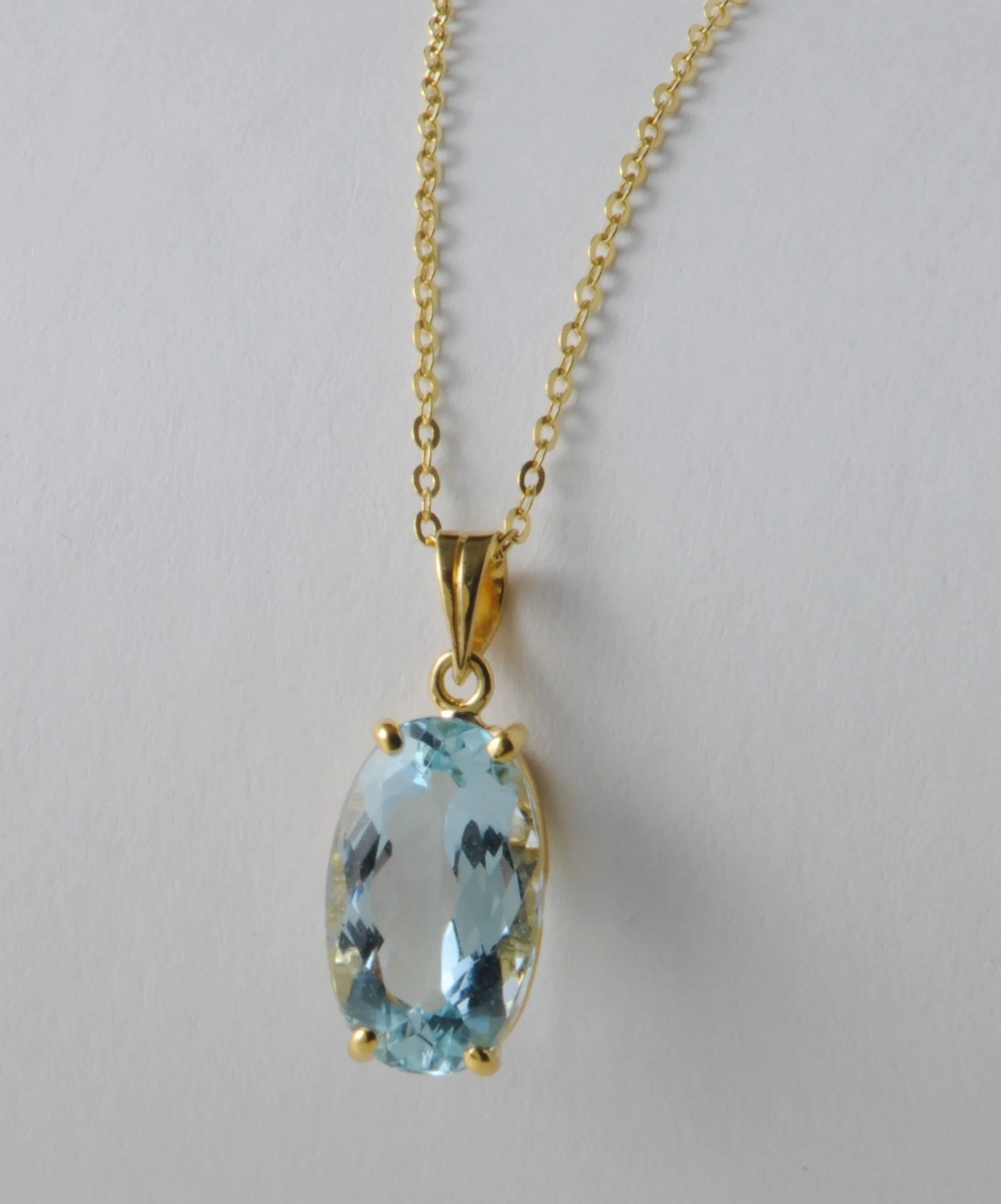 Aquamarine and 18k yellow gold pendant with 18k yellow 16" gold link chain.