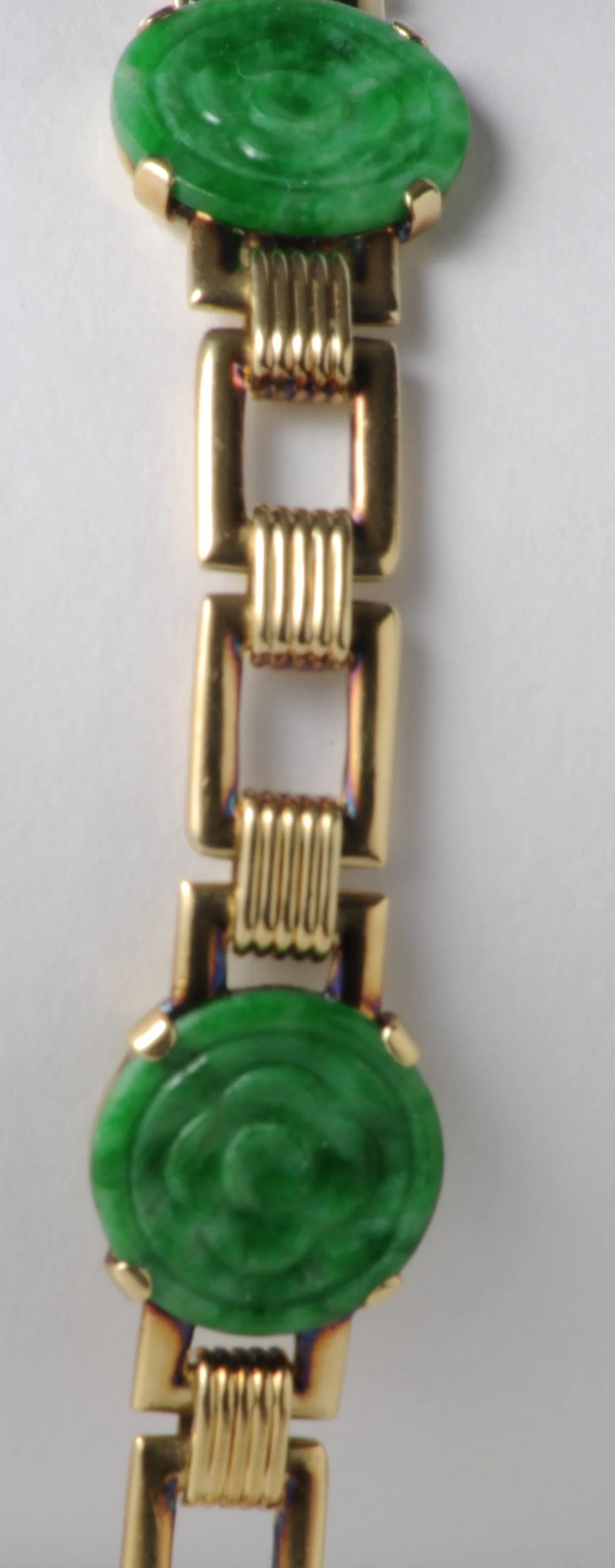 Detail of floral jadeite section of 14K yellow gold bracelet