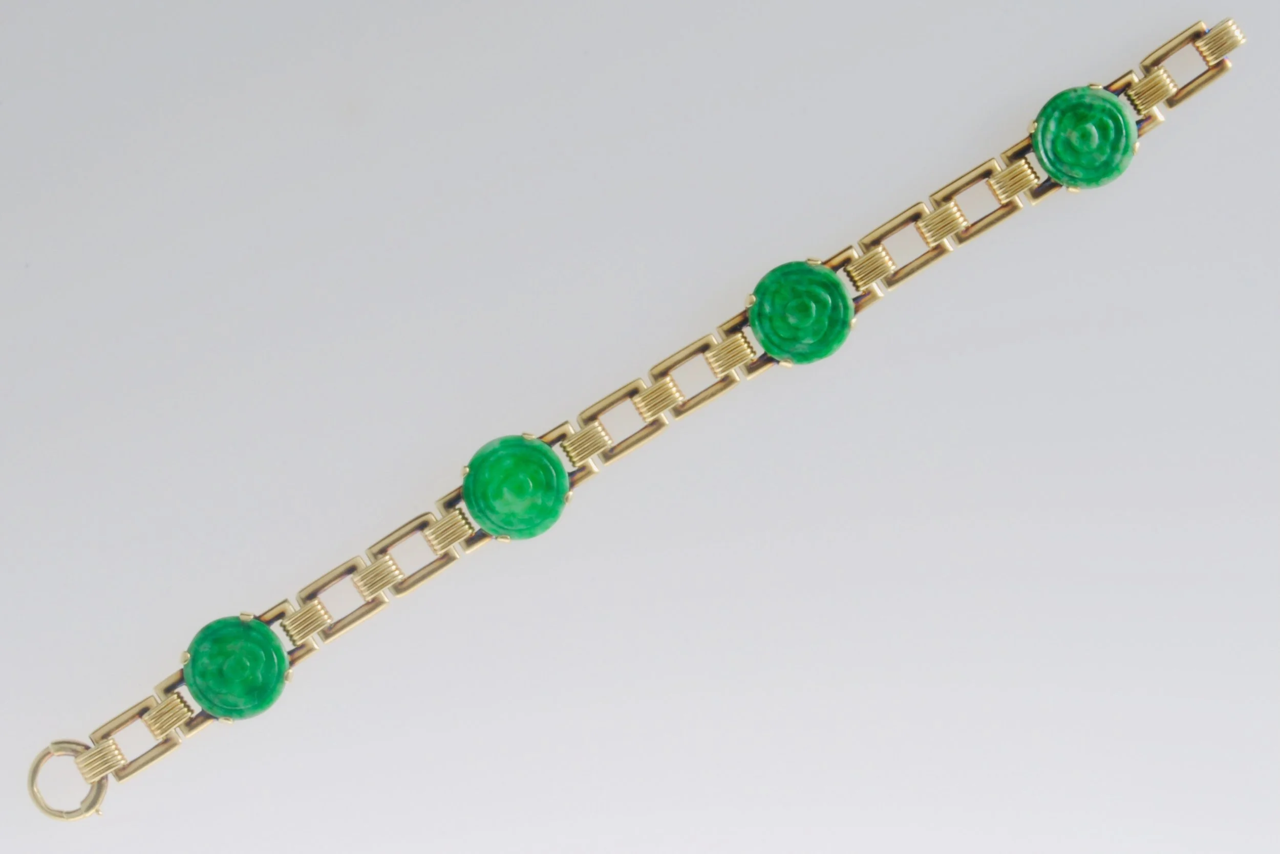 14k yellow gold Jadeite 4 stone link bracelet. Gold weight 14.4 grams. 