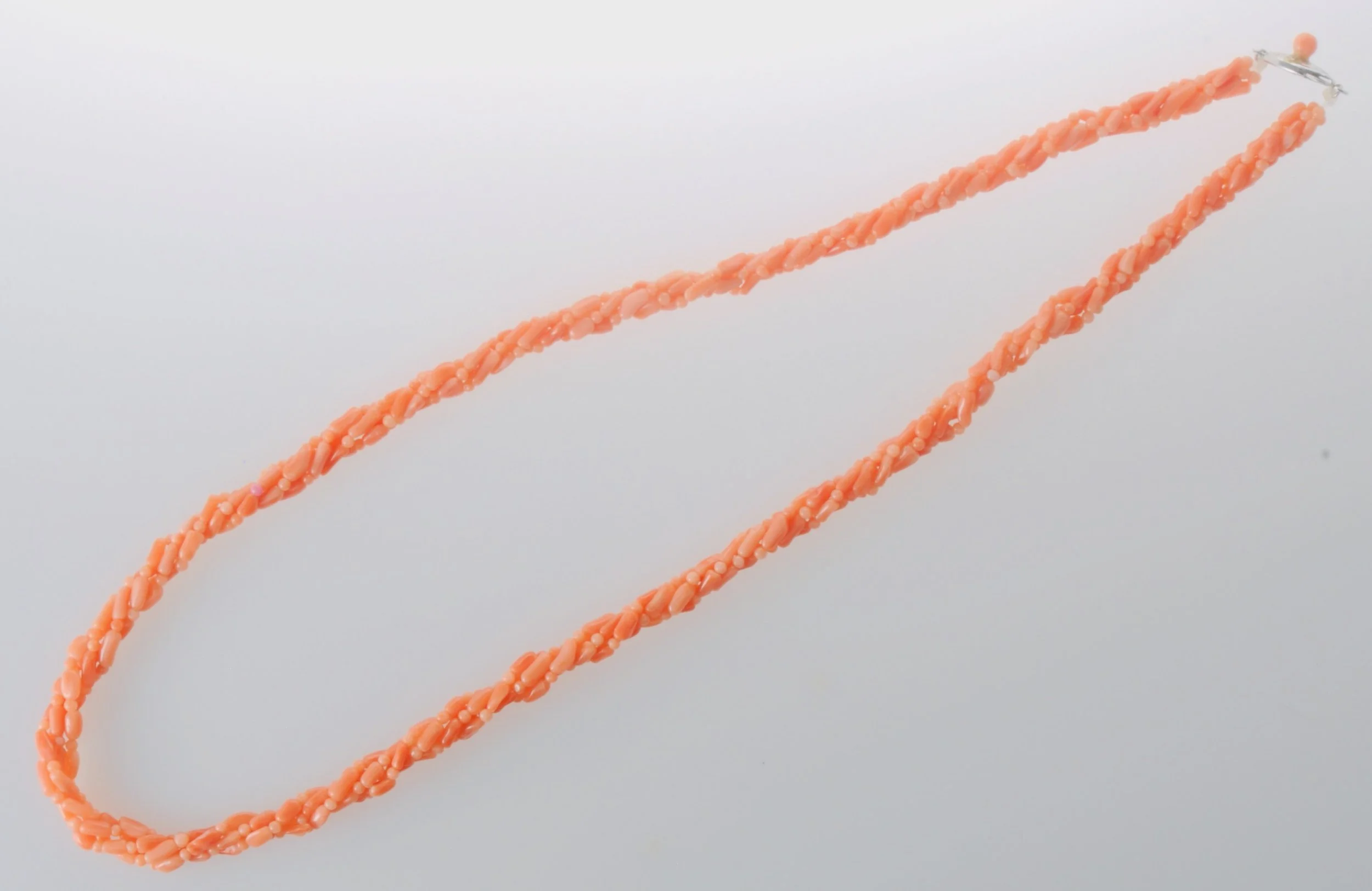 Coral beaded necklace with silver clasp.