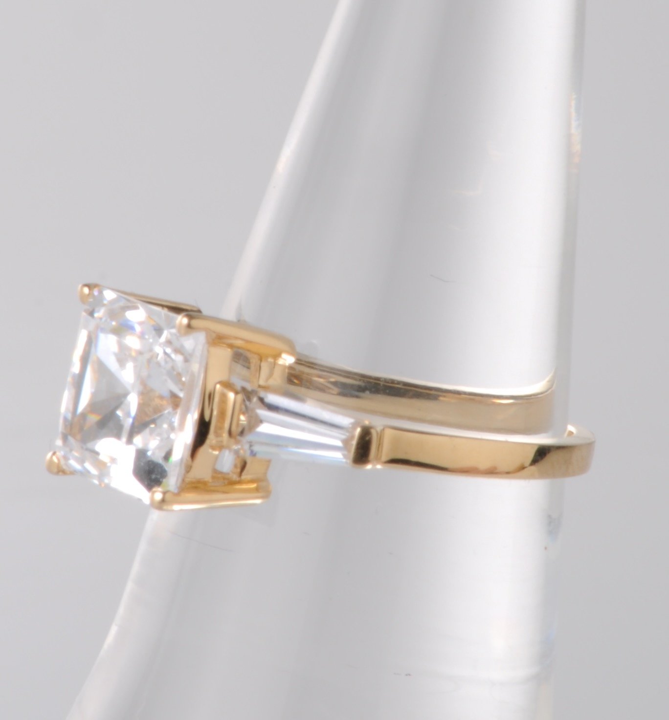 Side view of 14k yellow gold and cubic zirconia ring.