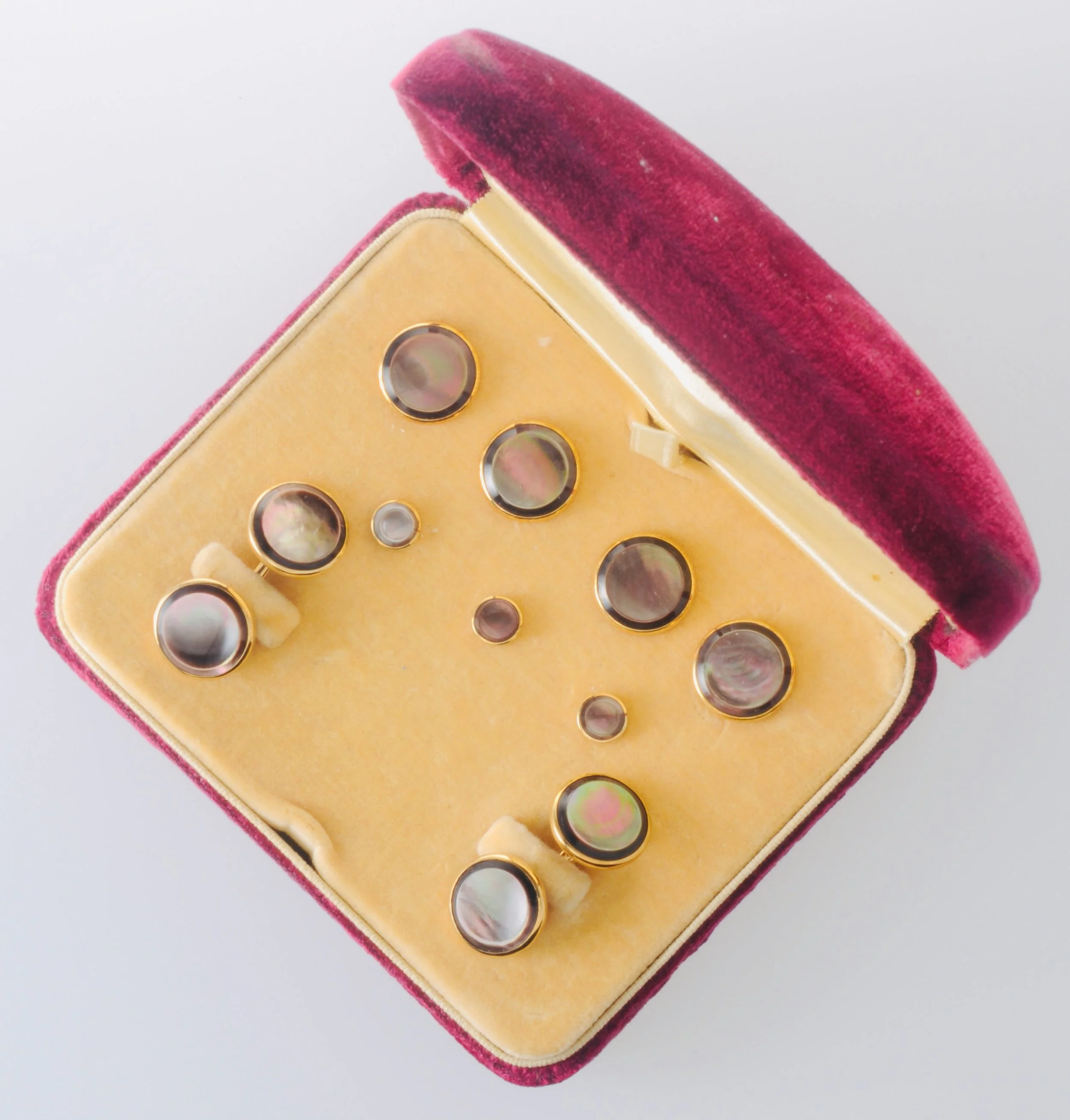 9 pc 14k yellow gold and abalone and onyx tuxedo cufflinks set in original box. Made by Carrington & Co of NJ, 1904-1950.