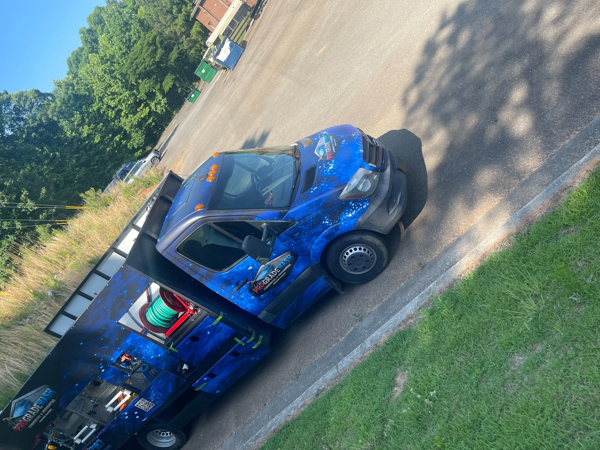 ProGrade Wash cleaning truck with equipment compartments open