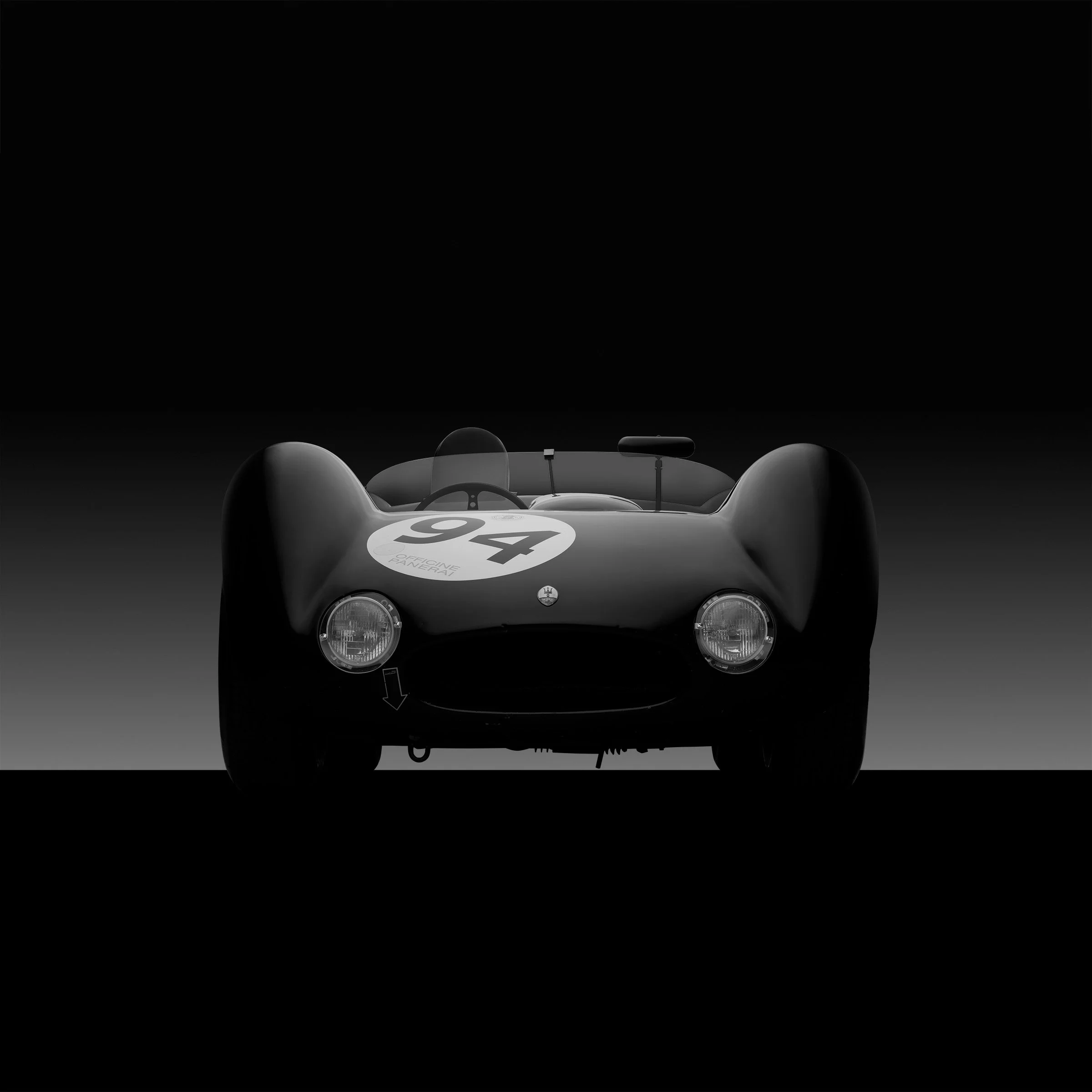 Line in Shadow by Bill Pack — an abstracted rear contour formed through hand-controlled illumination, reducing the vehicle to lines of light and shadow.