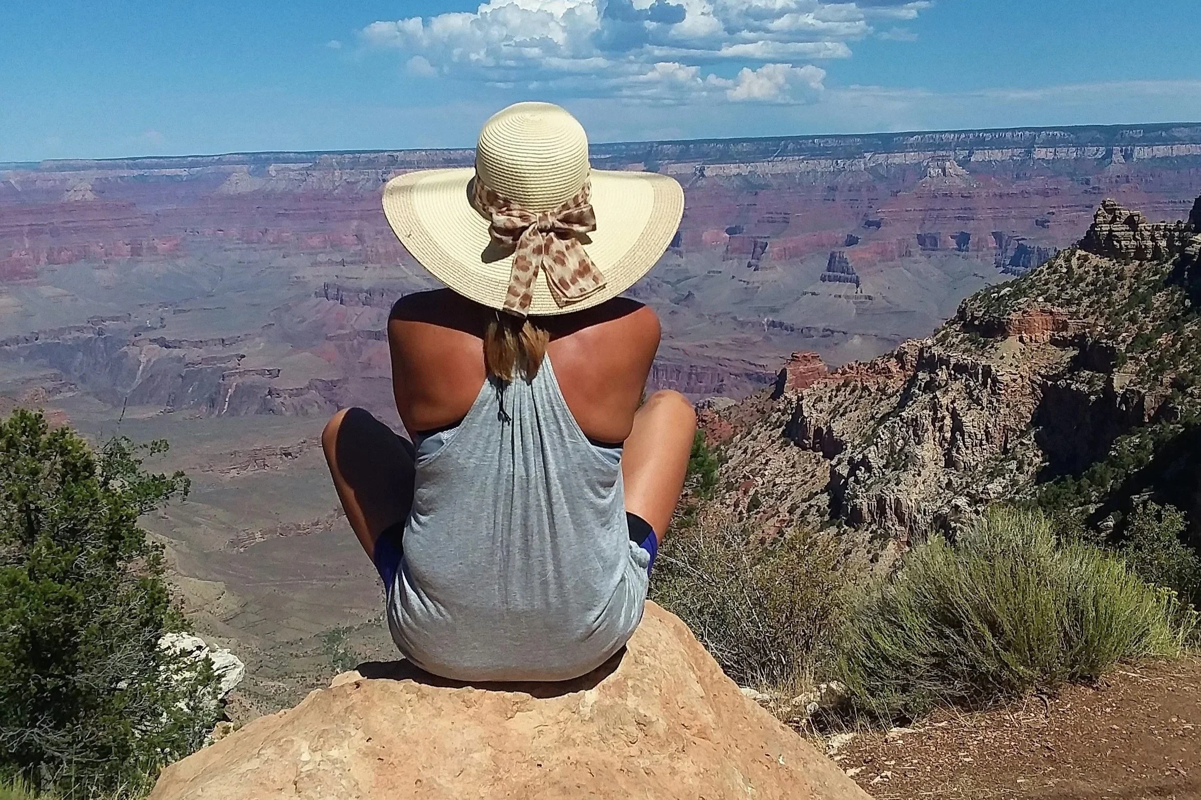 Heather Chirtea, the nation's first flying car pilot sits on the edge of the Grand Canyon